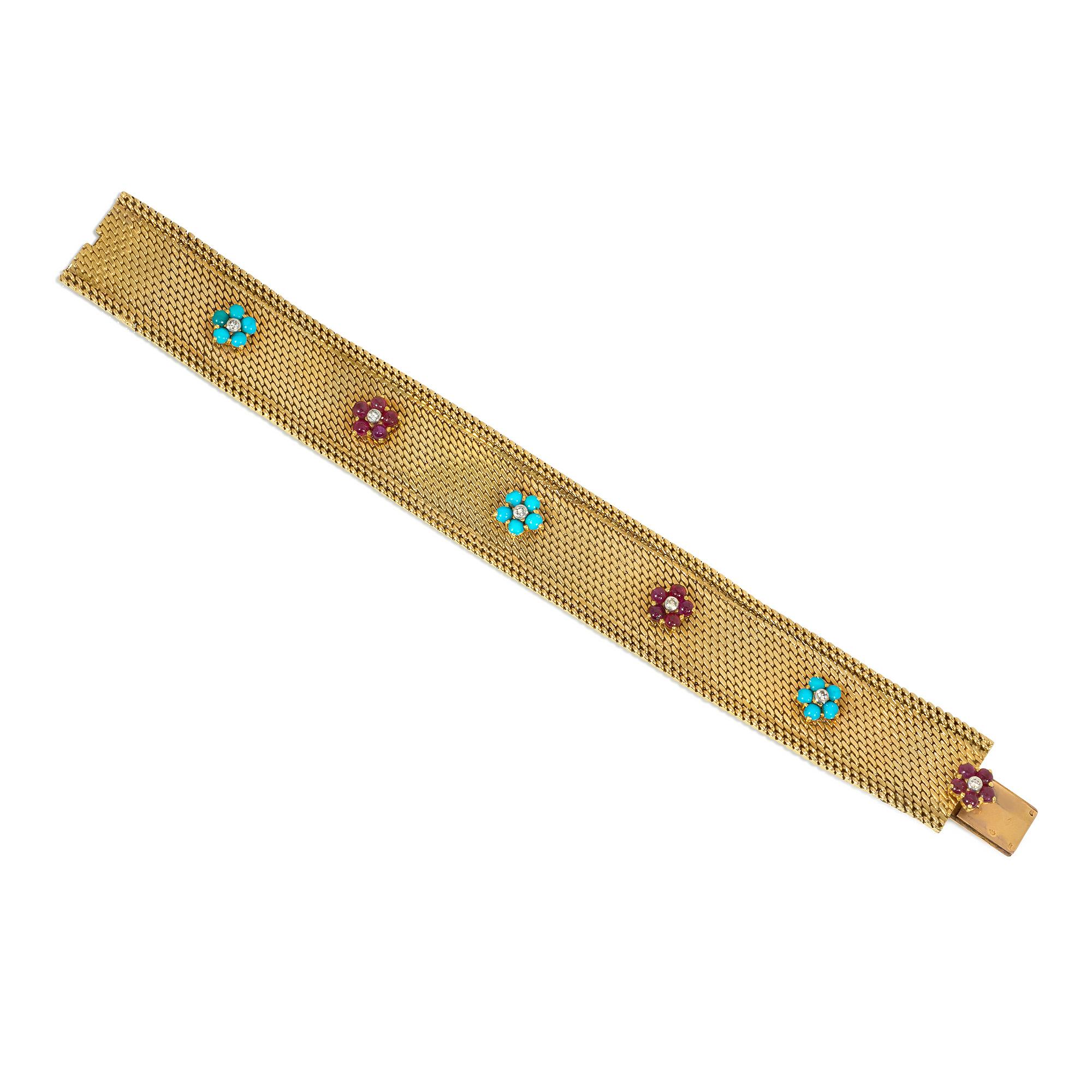 A mid-century woven gold strap bracelet with applied alternating turquoise and ruby florettes, each accented with diamond centers, in 18k and platinum.  Georges Lenfant for Marchak Paris, #43.387