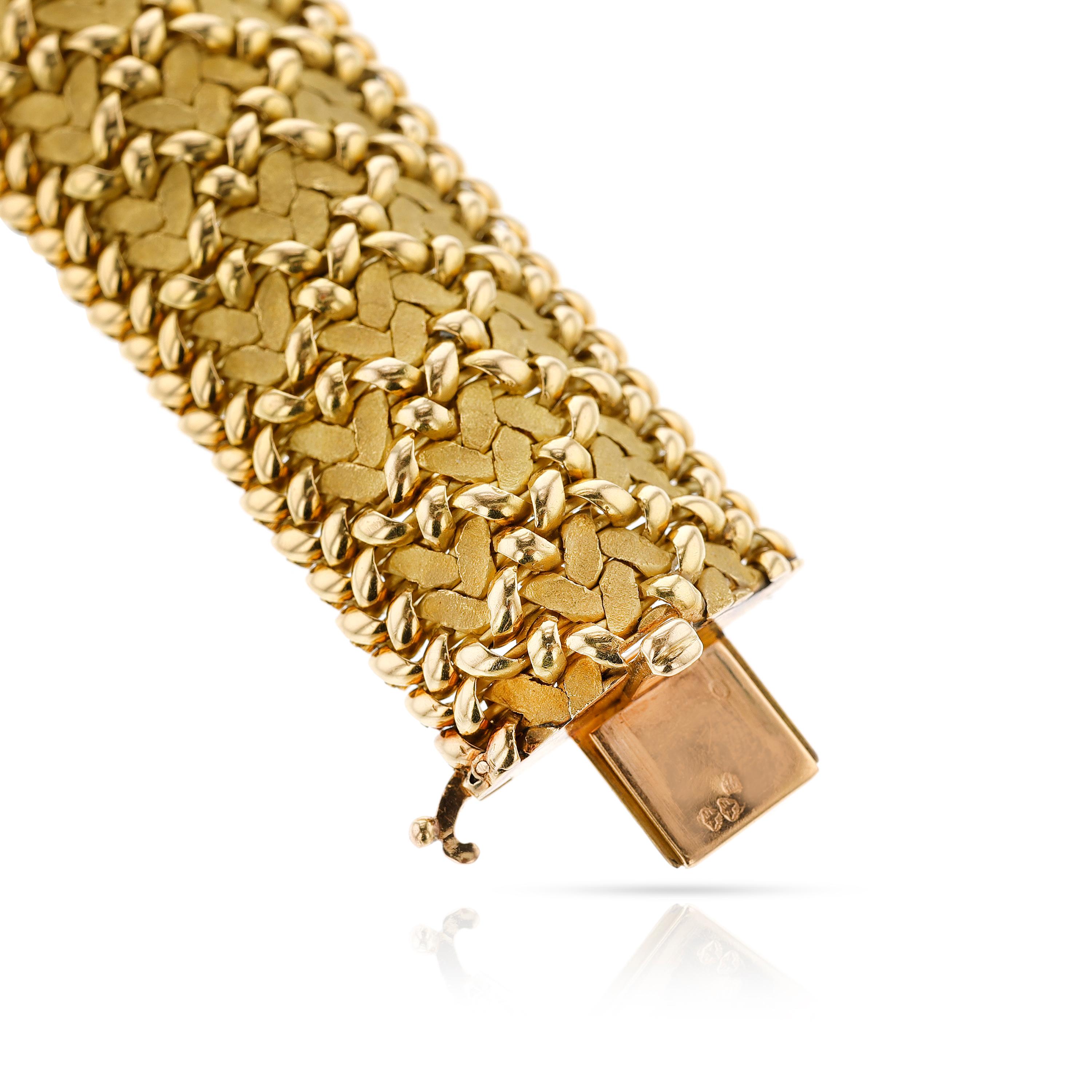 Georges L'enfant for Regner Paris Gold Woven Bracelet, 18k Gold. The bracelet is  a woven, bombe design with different finishes. The bracelet is circa 1970s. The length is 7.5 inches. The total weight is 109.15 grams. 

SKU: 1476-AMAJAJRPLW