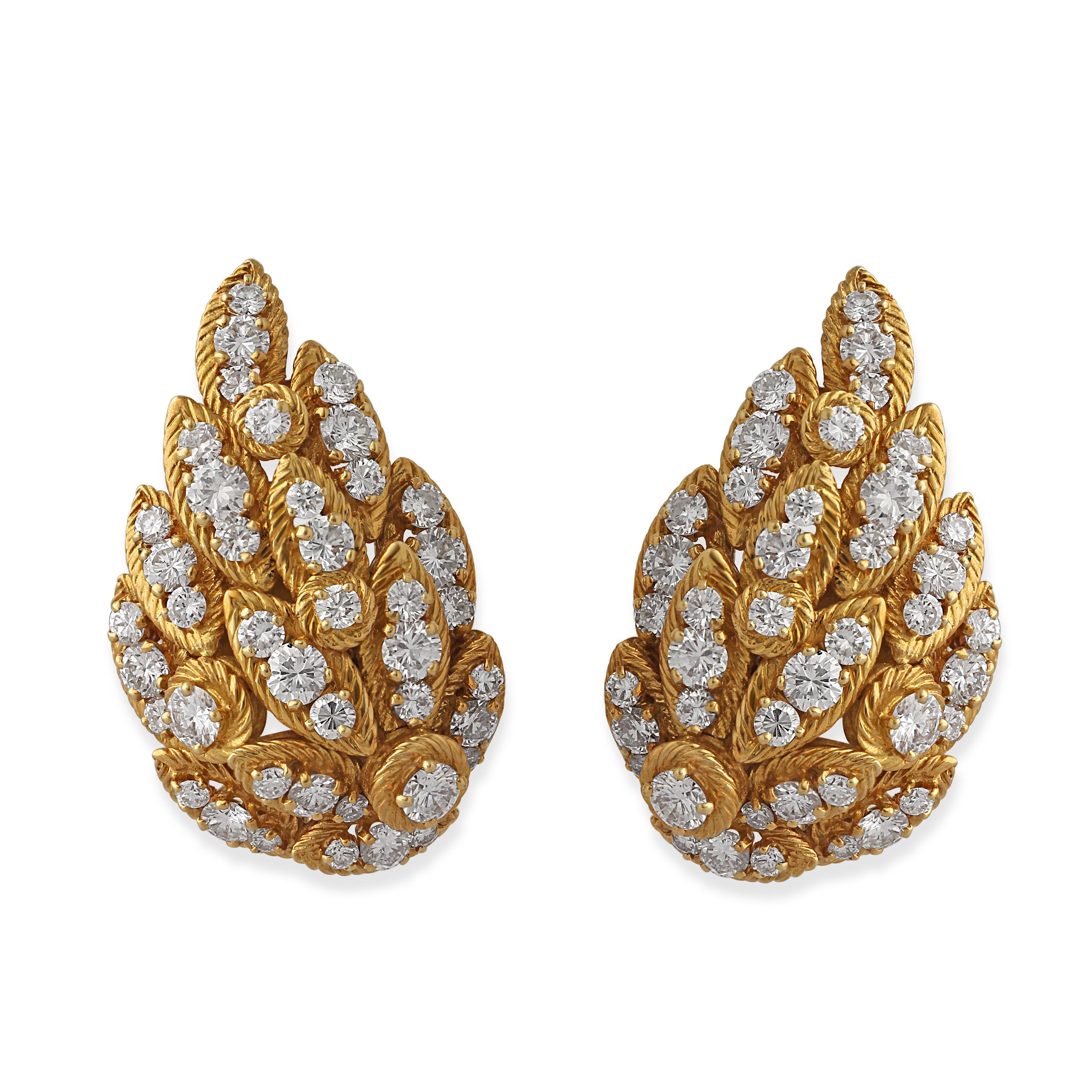 A pair of gold and diamond clip earrings made by Georges Lenfant for Van Cleef & Arpels designed as leaves in textured 18k yellow gold with diamonds. Circa 1970s. Weight = 29.20gr.

Georges Lenfant was an exceptionally skilled jeweller who produced