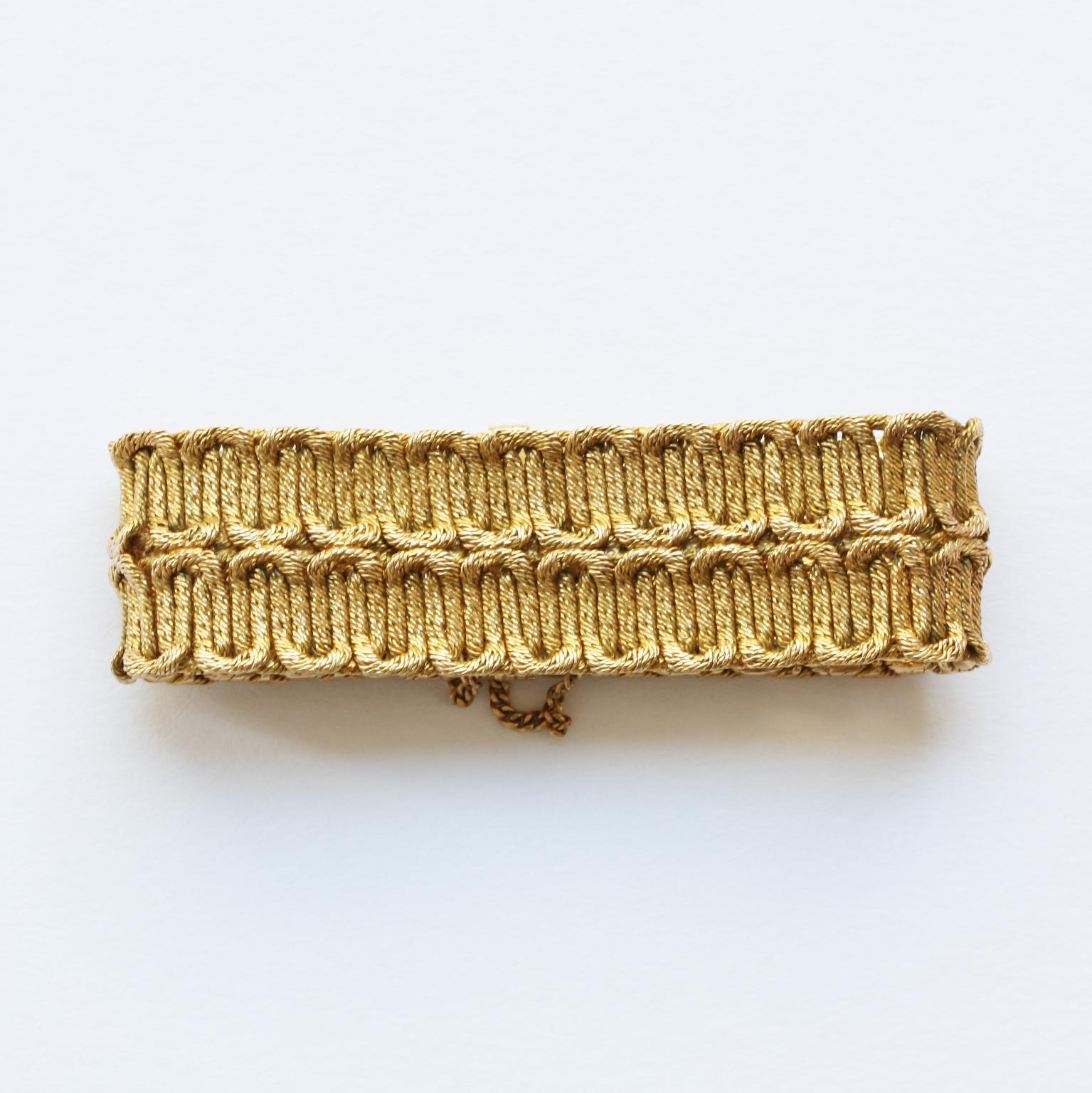 An 18 carat gold bracelet by Georges Lenfant. Lenfant made some of the finest chain work you have ever seen. Double rows of conjoined U shaped links in Lenfant’s typical braided gold, France, circa 1970. Alas the master mark is no longer legible so