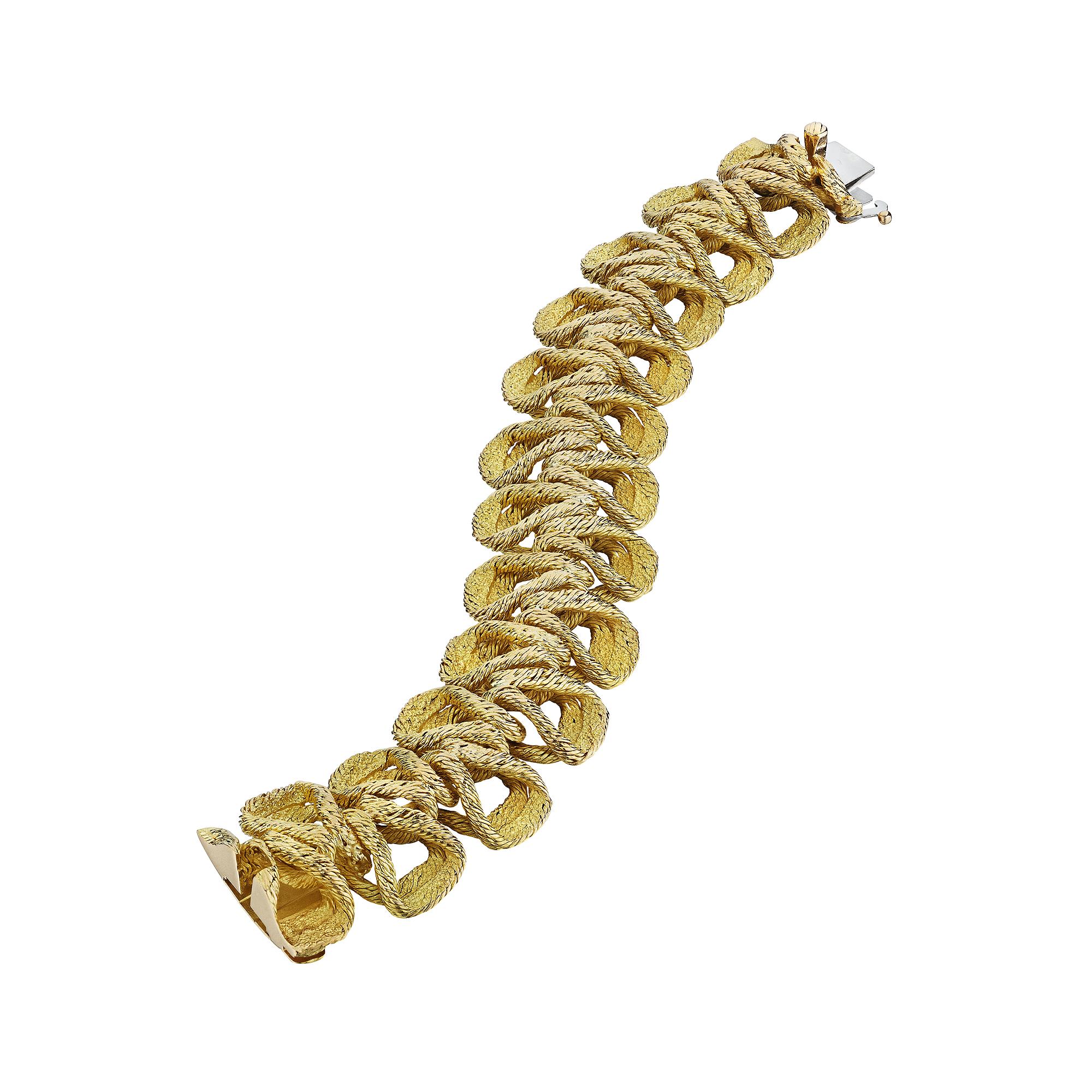 Looking like the finest of ruched silk passementerie ribbon trim, this Georges L'Enfant vintage 18 karat yellow gold bracelet is uncompromisingly unique.  Easy to wear and addictive to look at, this sumptuous bracelet is masterfully executed and