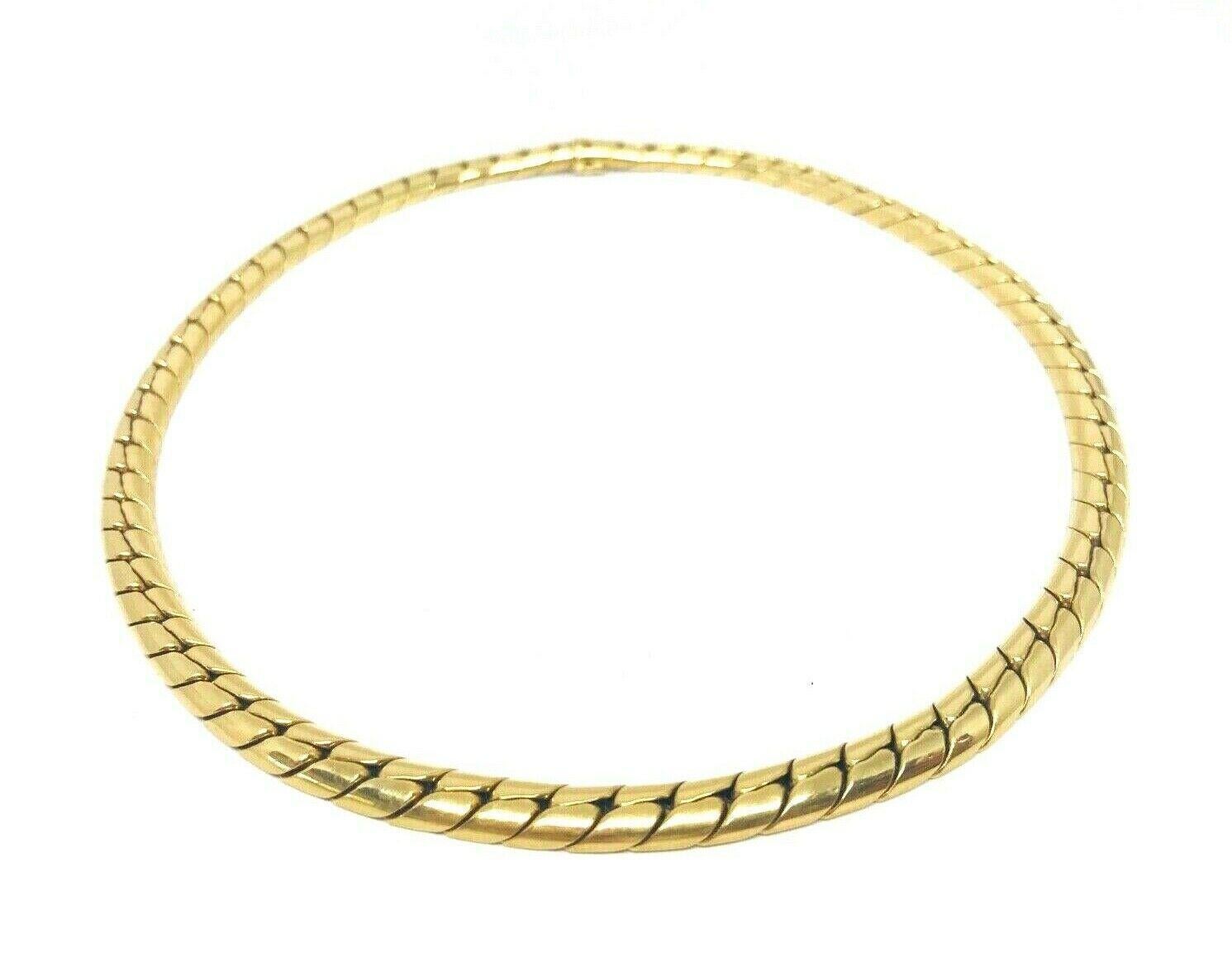 Chic French 18k yellow gold vintage choker necklace by Georges Lenfant. Stamped with the Georges Lenfant maker's mark and a French mark.
Measurements: 16