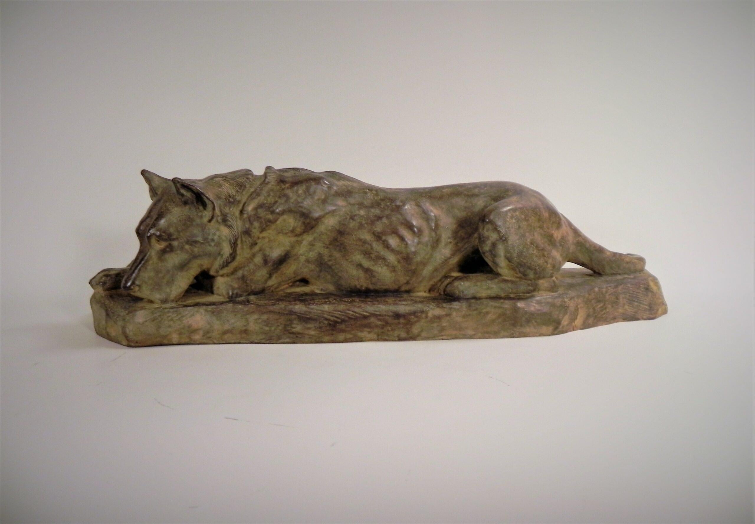 Lying German Shepard Dog
A bronze cast of a resting German Shepard Dog, by Georges-Lucien Guyot (1885-1973). An early work, and a cast of 1920 with a brown patina with some reddish undertones and white yellow highlights. Signed G.L. Guyot and