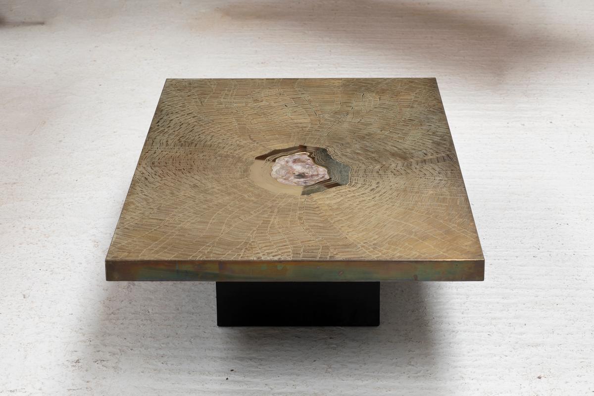 Coffee table designed by Georges Mathias for Lova Creation in Belgium in the 1980s. This rectangular coffee table is a true piece of art and features a polished brass table top on a black socket. An expanding etched drawing, starting from the