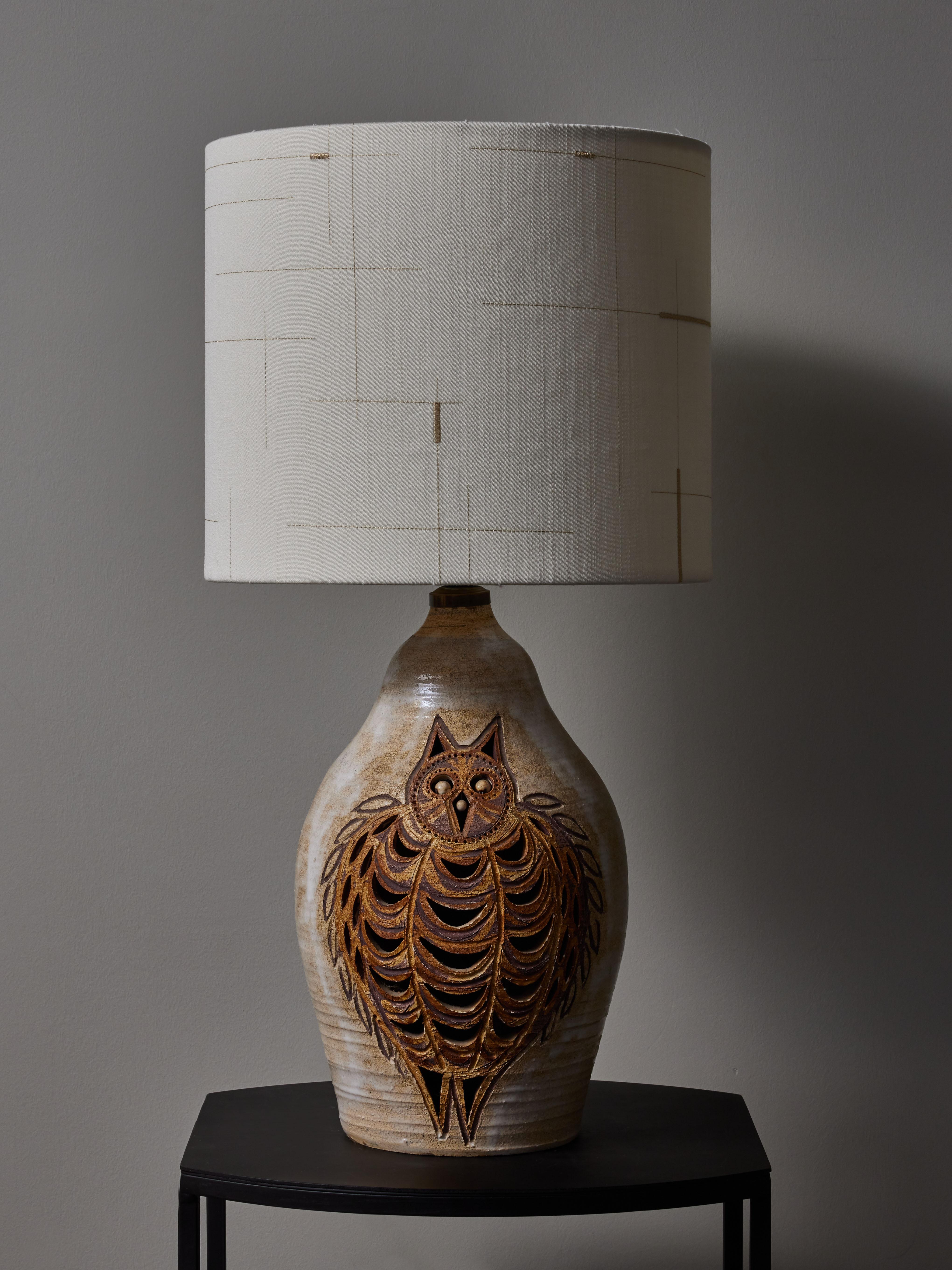Ceramic table lamps made by Georges Pelletier, Owl deco on the face. New Dedar Milano fabric lampshade.


Georges Pelletier
Born in 1938 in Brussels, Belgium, Georges Pelletier is a ceramist who lives and works in Cannes, France. His ceramics are