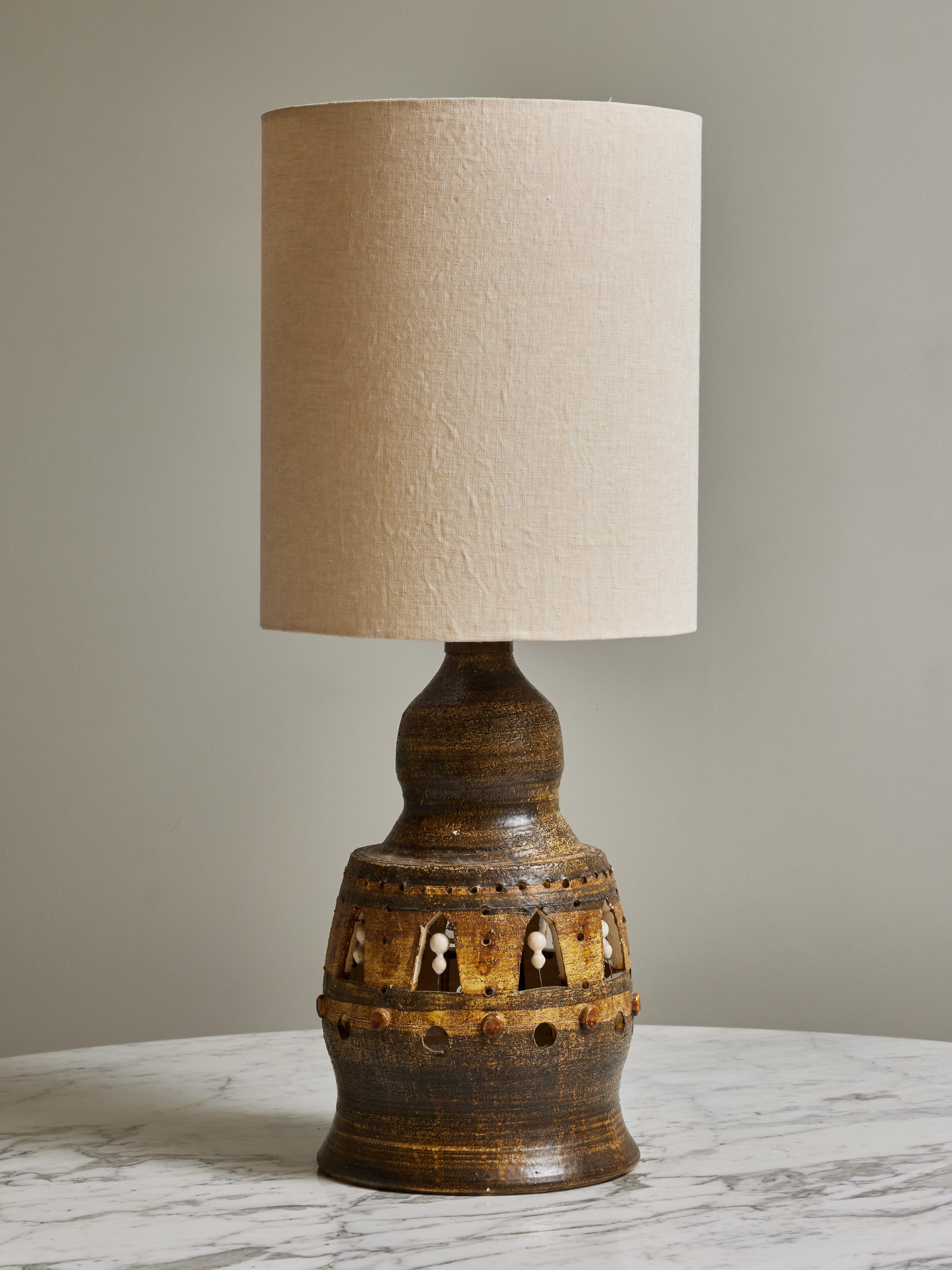 Ceramic table lamp with different glaze by the french artist George Pelletier.
Inner lighting as well as a regular bulb, hidden by a newly made shade.

Born in 1938 in Brussels, Belgium, Georges Pelletier is a ceramist who lives and works in Cannes,