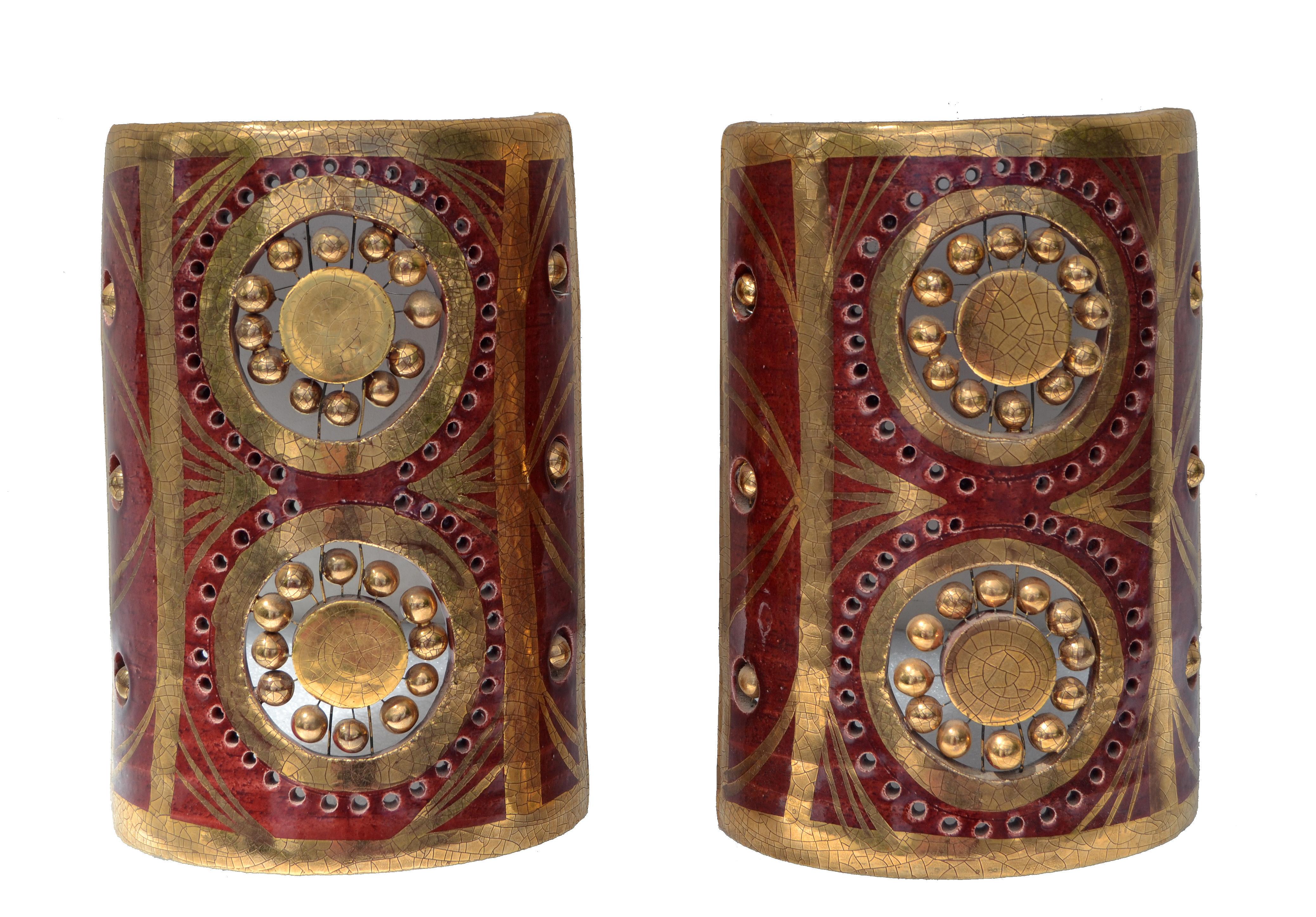 Gorgeous pair of sconce by Georges Pelletier, from Vallauris, France. 
Bordeaux and gold ceramic in very detailed.
 