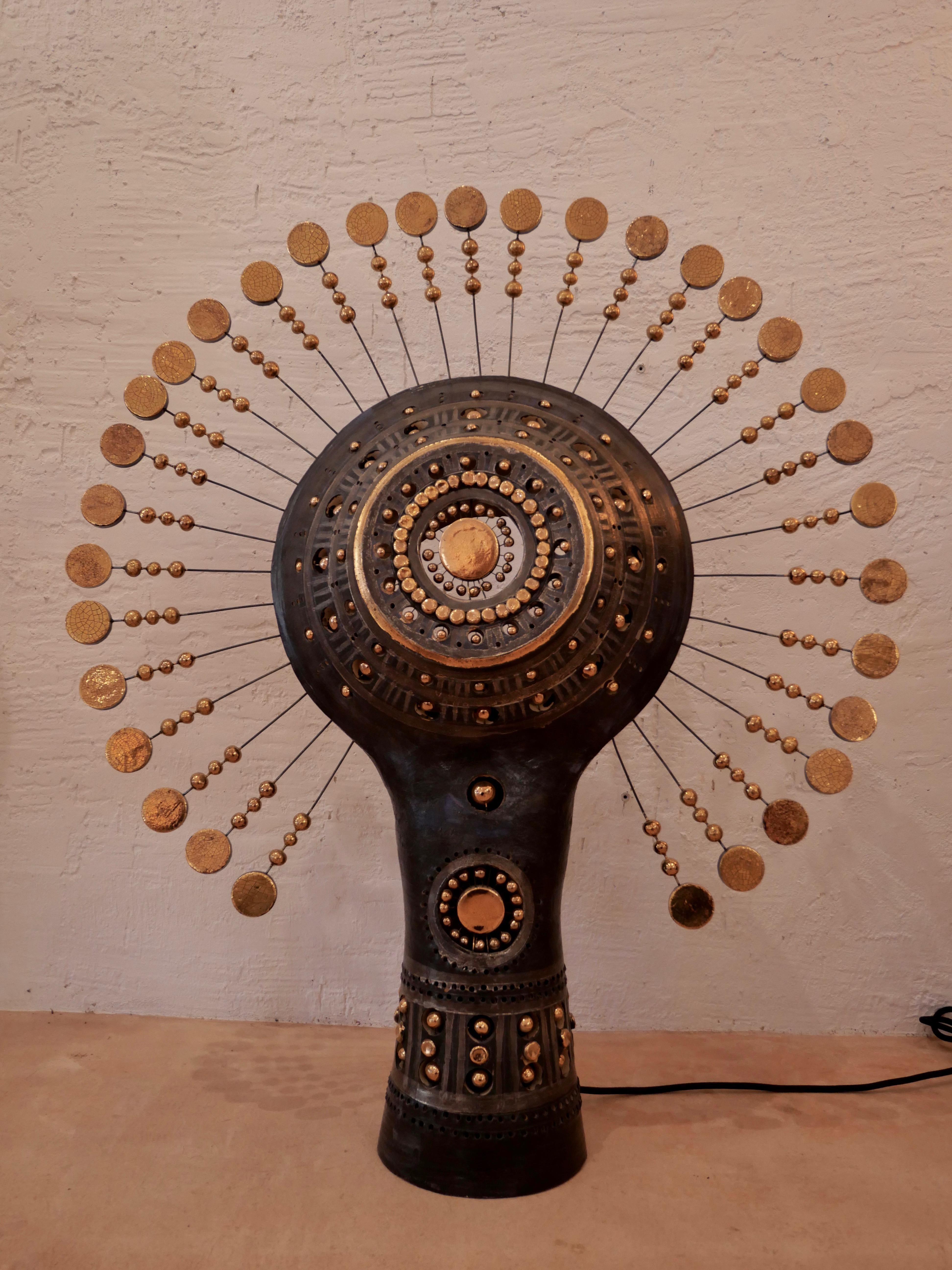 Sun lamp in Bluich black gold and platinum enameled ceramic, sculptural floor or table lamp bringing to your space an amazing light experience when the night falls, and a stunning sculptural presence during the day. Approx dimensions height 80 cm x