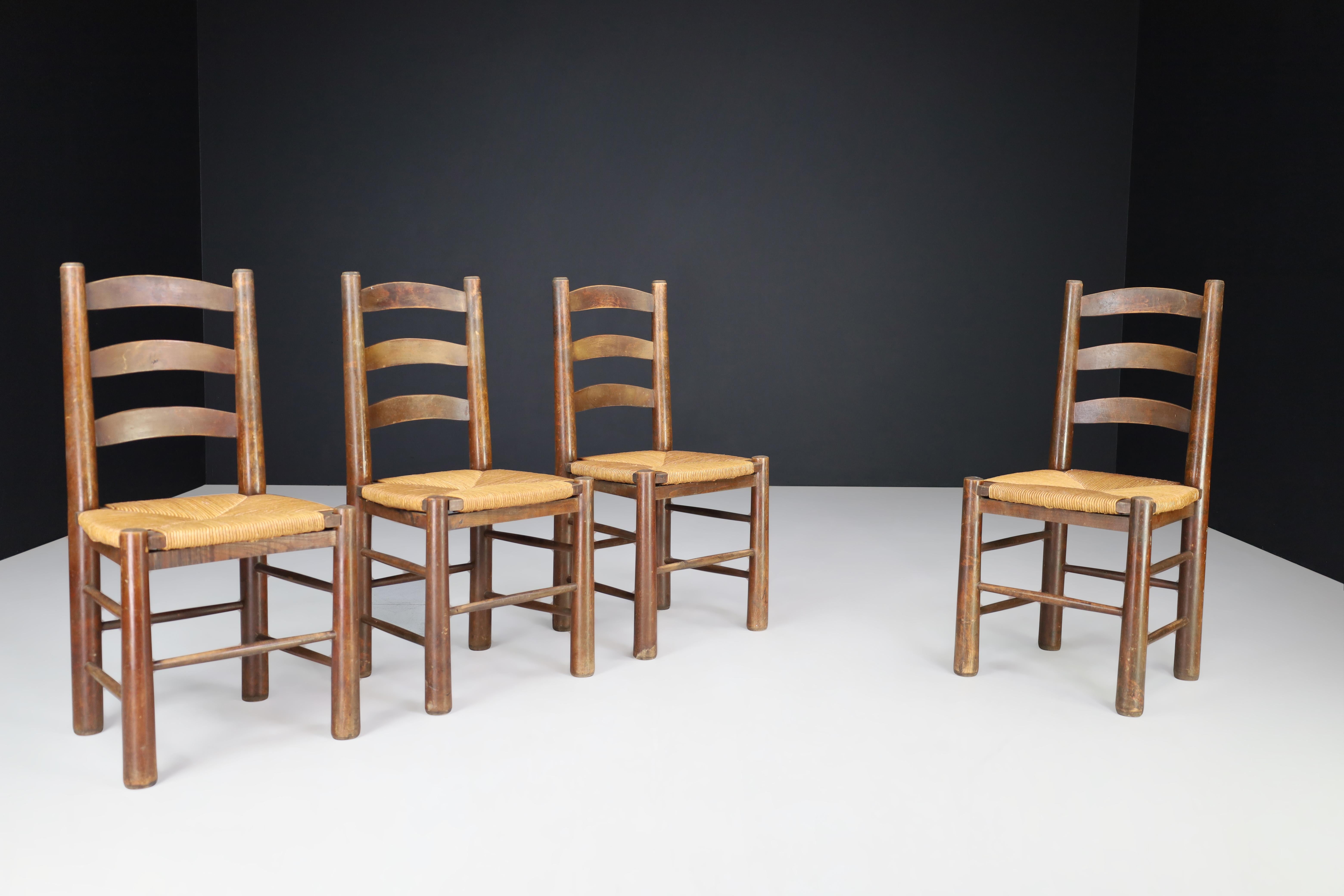 Georges Robert dining chairs in oak and rush, France, 1950s.

These Georges Robert dining chairs in oak and rush were crafted by French cabinetmaker Meubles Georges Robert in the 1950s. They are perfect for a mountain or chalet setting and offer a