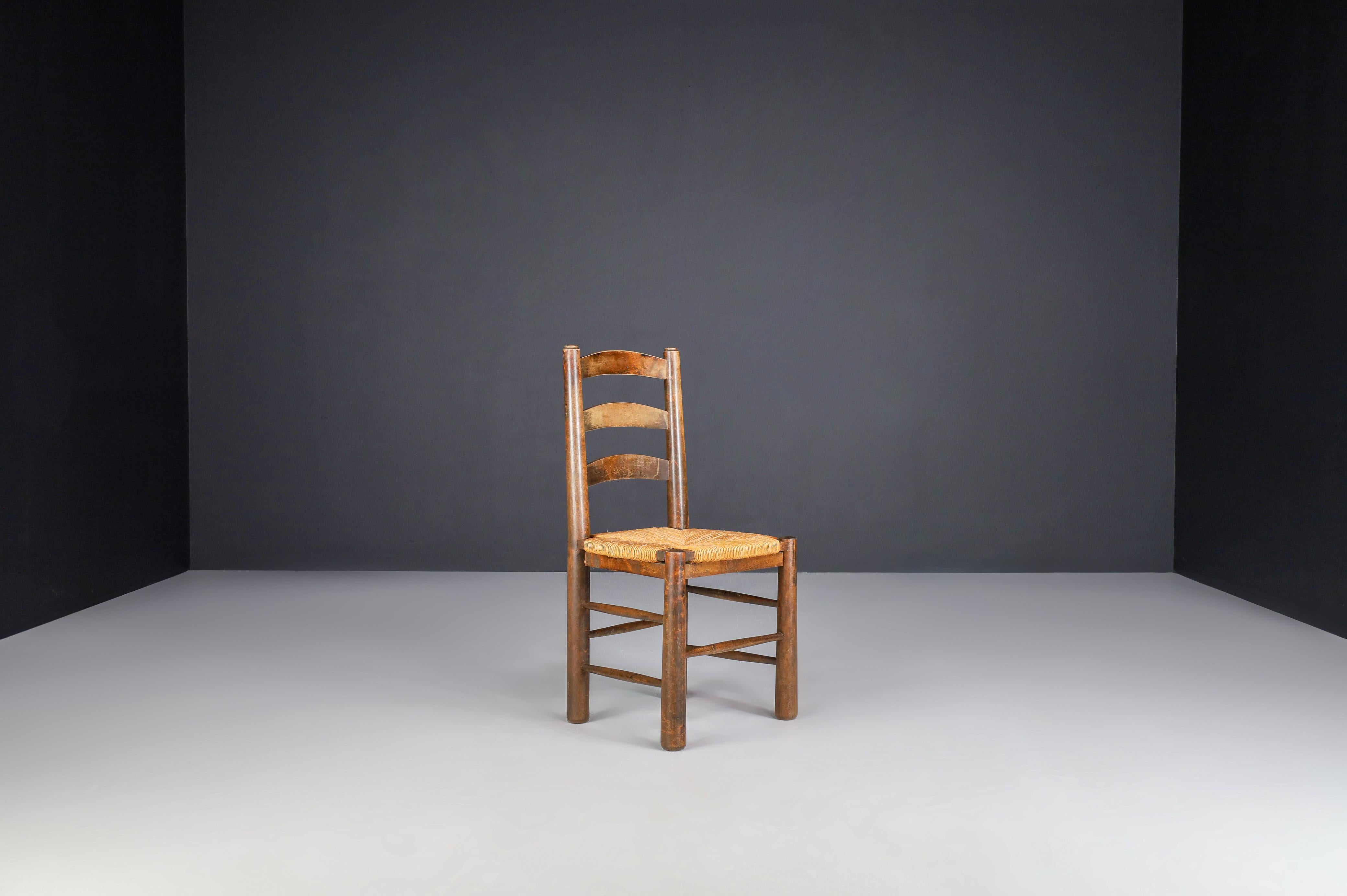 Brutalist Georges Robert Dining Chairs in Oak and Rush, France, 1950s For Sale