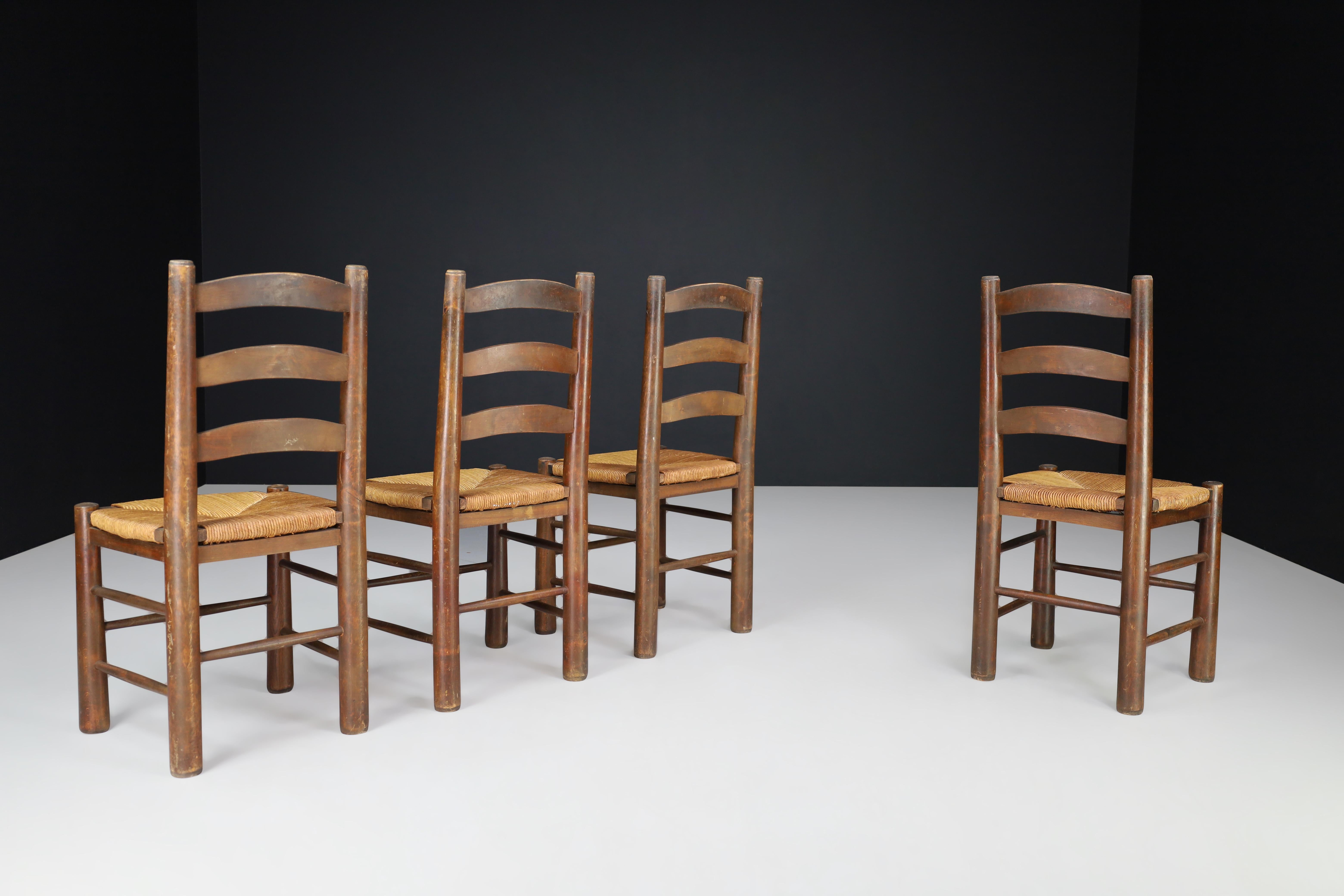 Brutalist Georges Robert Dining Chairs in Oak and Rush, France, 1950s For Sale