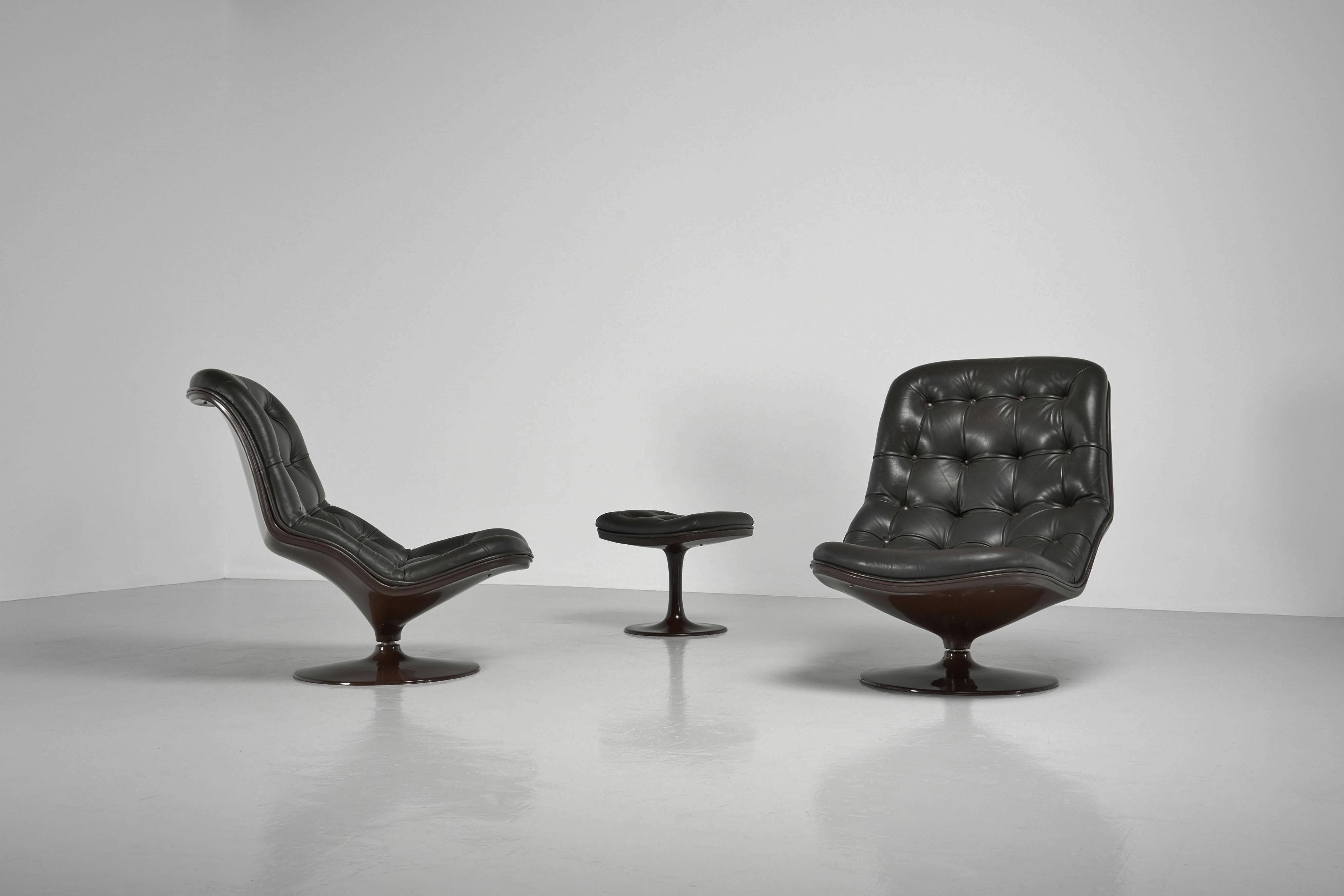 Amazing set of 2 so called ‘Shelby’ lounge chairs designed by Georges Van Rijck and manufactured by Beaufort, Belgium 1970. This is for a set of 2 adjustable lounge chairs and a foot stool, made of chocolate brown fiberglass and dark brown leather