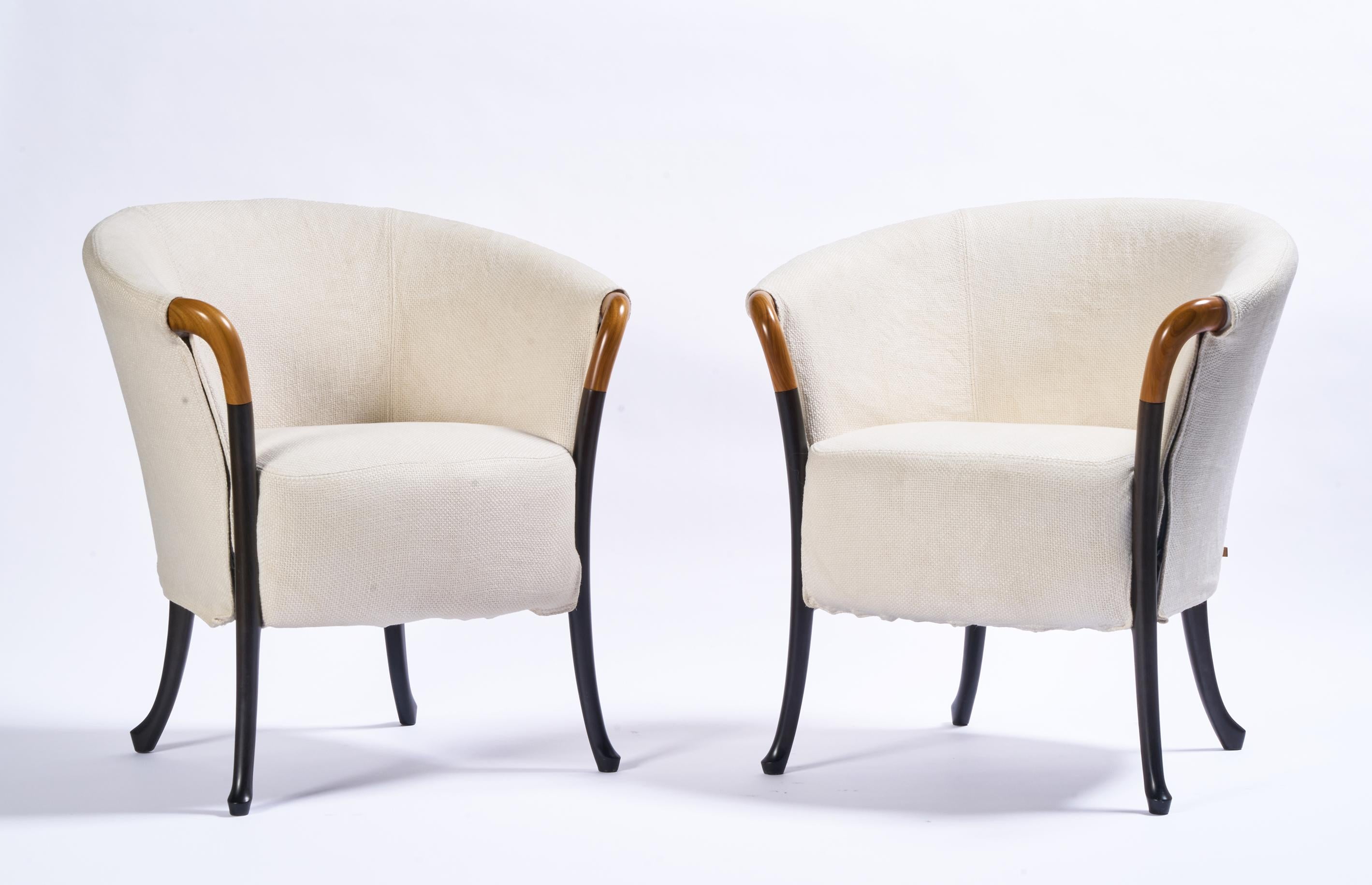 Progetti armchairs by Umberto Asnago for Giorgetti, Italy, circa 1980s/1990s. Ivory linen/silk blend slipcover fabric is original & shows minor wear.  Sabre style legs show minor wear to finish, nothing to note. Elegant and comfortable chairs.
