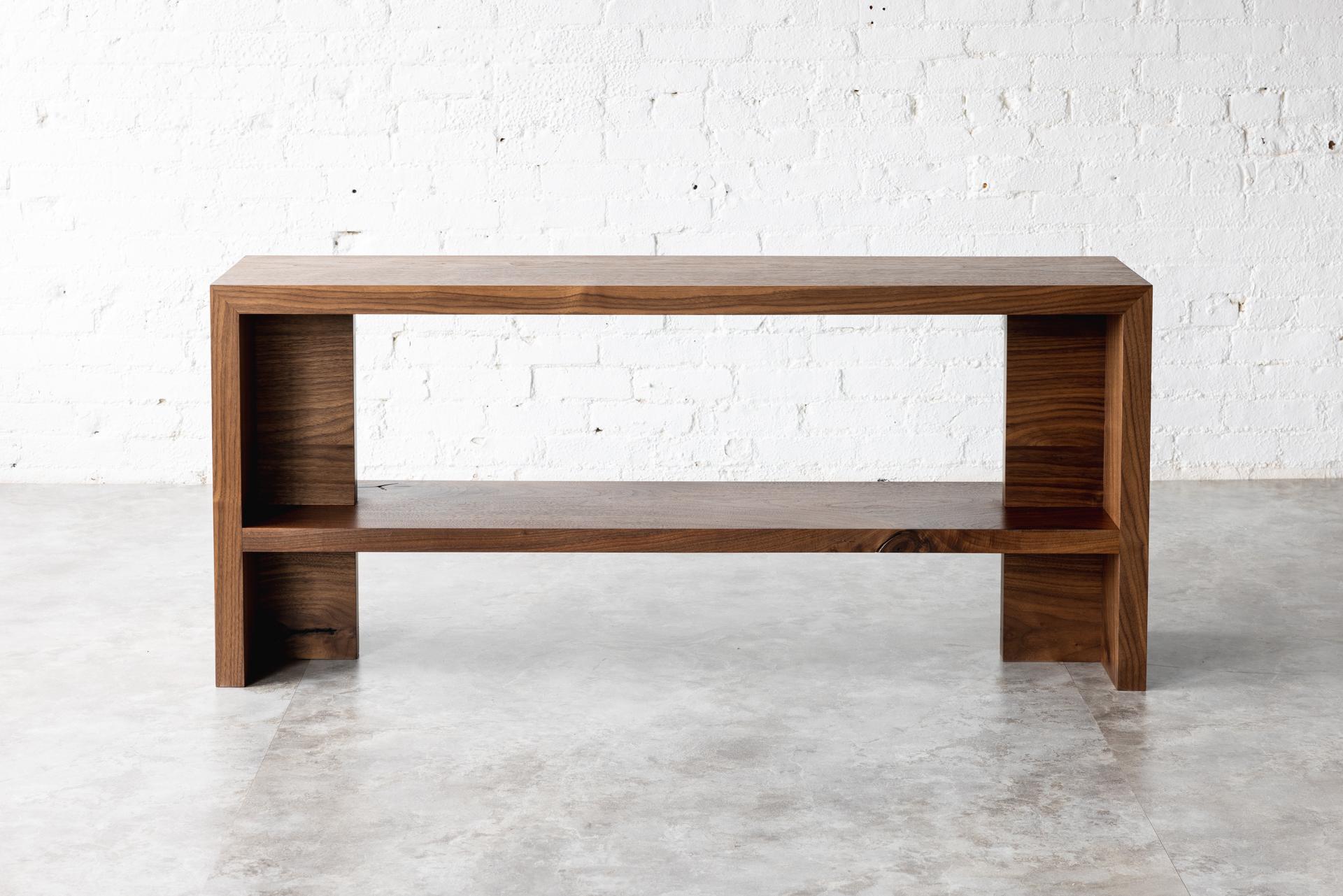 The Georgia console is our stunning black walnut console table, the perfect addition to any contemporary home. Crafted with the finest quality black walnut wood, this console table boasts a sleek and modern design that is sure to impress.

Measuring