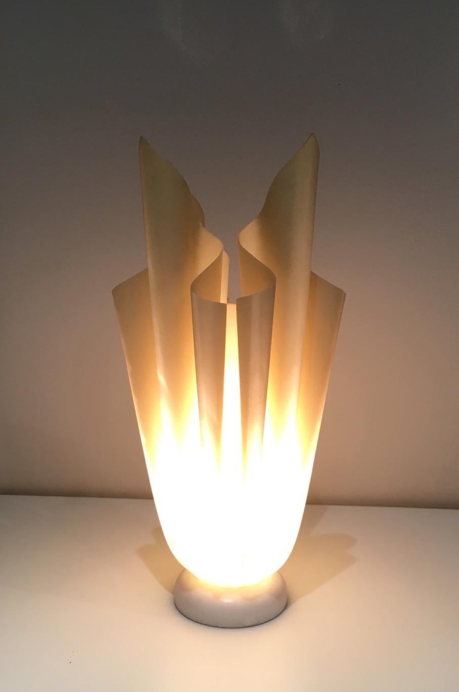 This flaming torch lamp is made of resin on a marble base. This is the Ophelie lamp by Georgia Jacob, circa 1970.