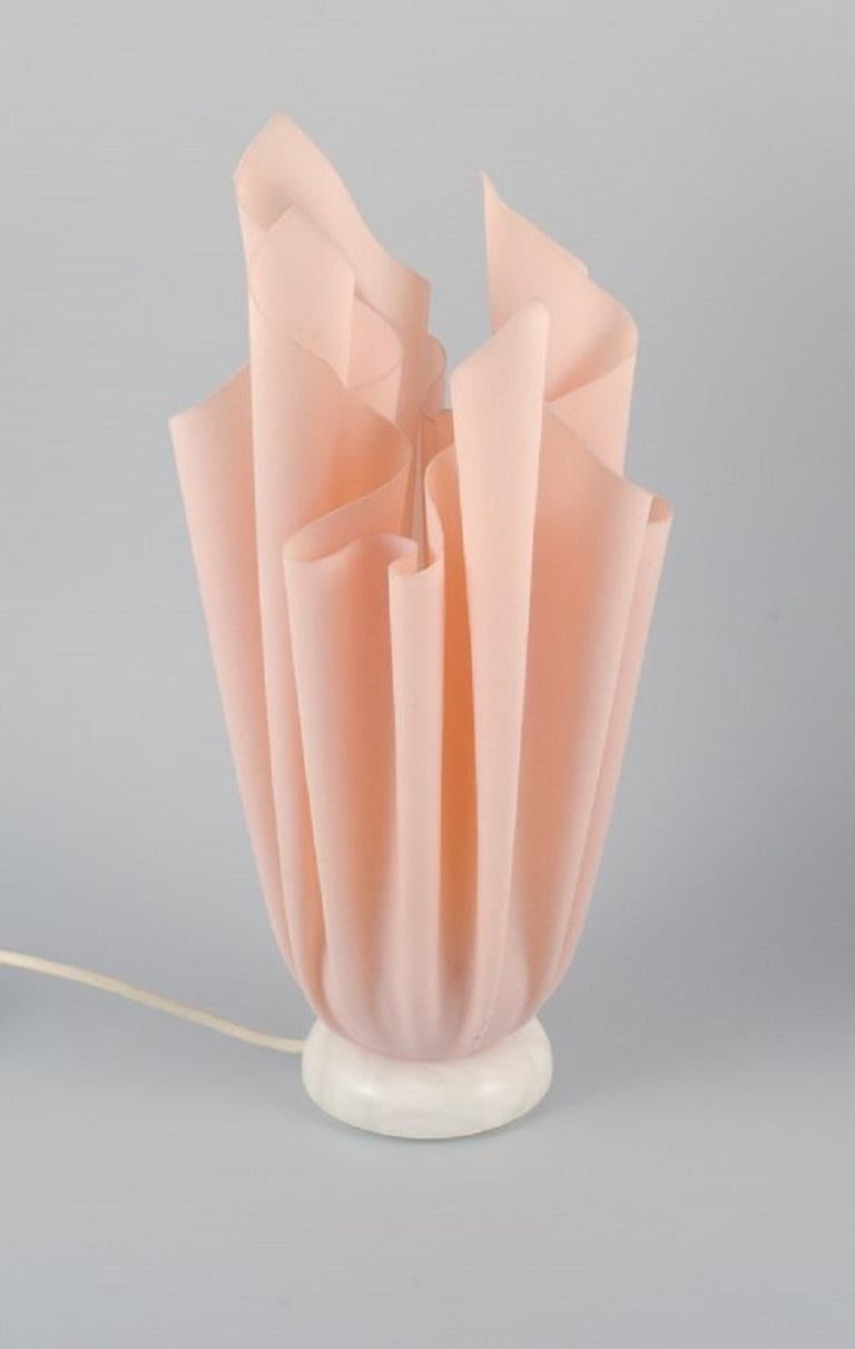 Georgia Jacobs, French designer, a pair of rose-coloured table lamps in resin on a marble base.
Model 