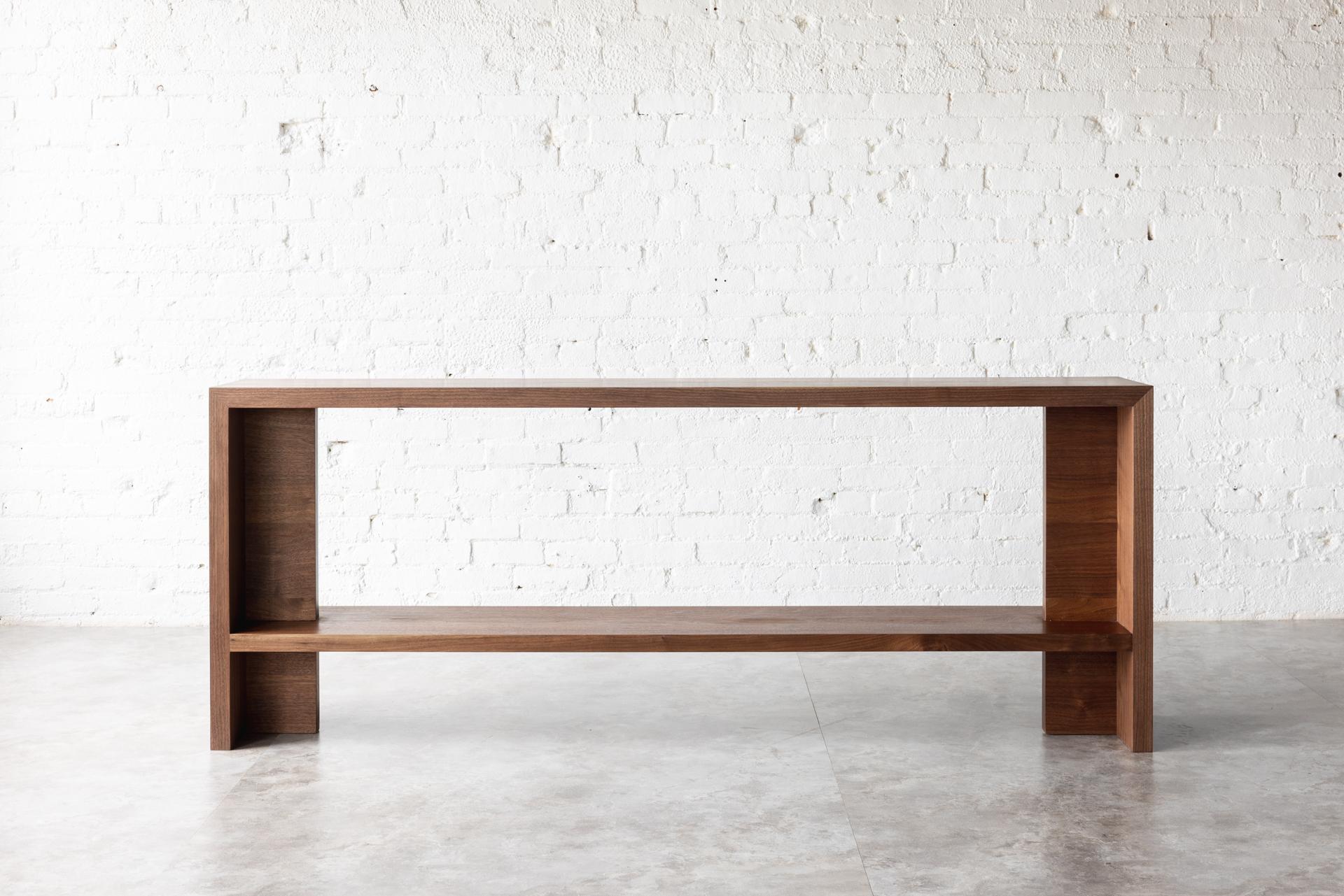 The Georgia console is our stunning black walnut console table, the perfect addition to any contemporary home. Crafted with the finest quality black walnut wood, this console table boasts a sleek and modern design that is sure to impress.

Measuring