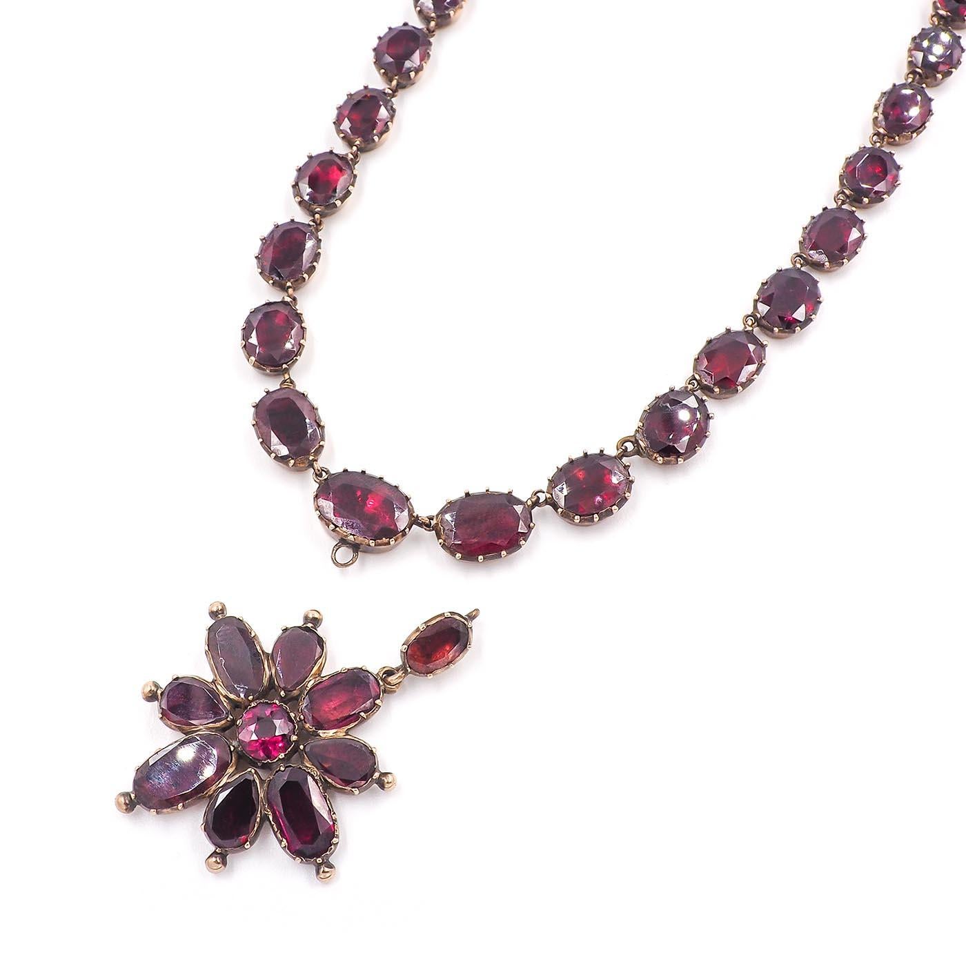 Original Georgian era Garnet Rivière Pendant Necklace composed of 10k yellow gold. With oval-shaped flat cut natural red garnets, foil-backed in collet settings. Necklace measures approximately 15.75