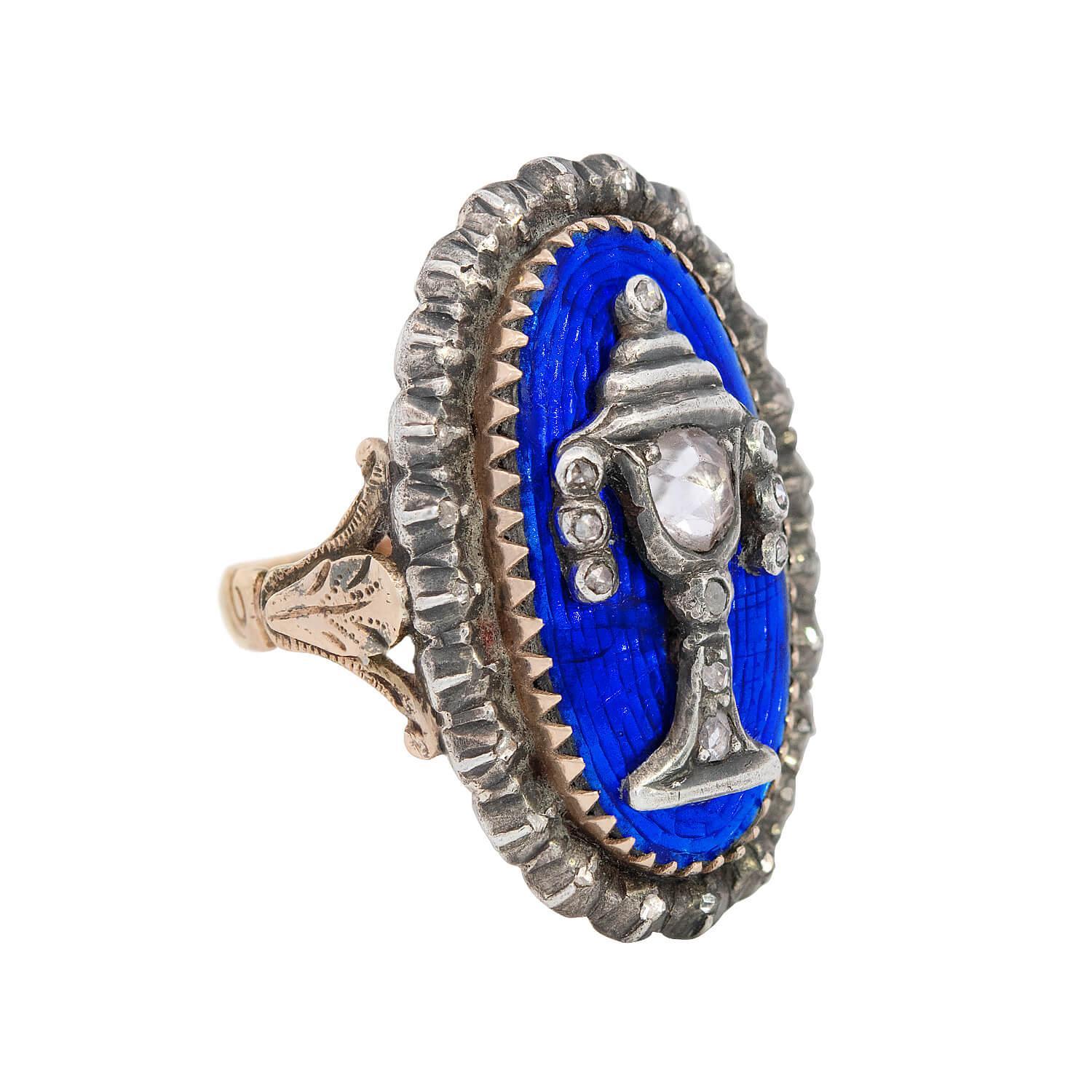 An exceptional and unusual memorial urn ring from the Georgian (ca1779) era! Crafted in 14k gold and sterling silver, this piece is richly detailed and serves as a fine example of the mourning jewelry tradition. The ring features an oval-shaped