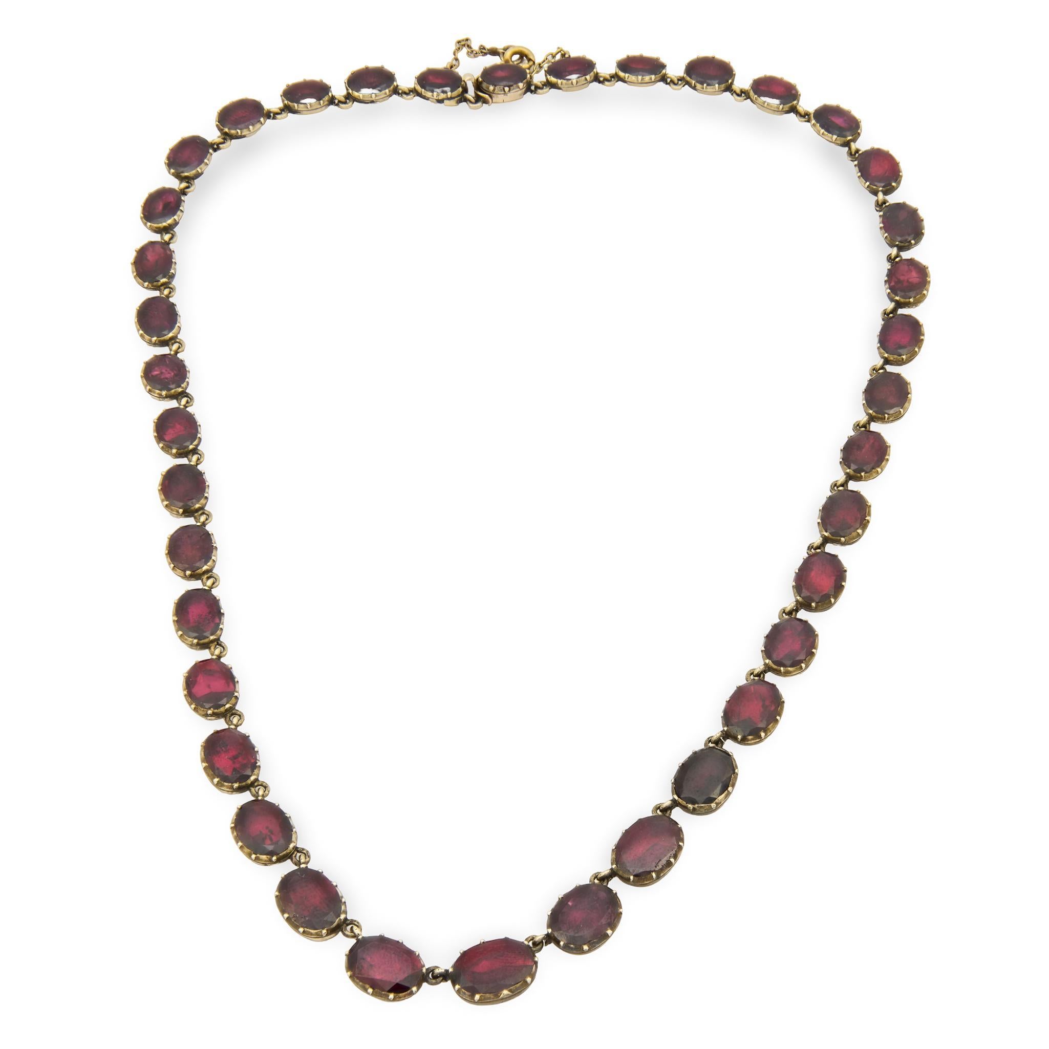 A beautiful necklace from the Georgian (ca1750s) era! Crafted in 14k yellow gold, this necklace is comprised of 38 garnet links. Each oval-cut garnet is held within a backed multi-prong setting, and the stones have an approximate total carat weight