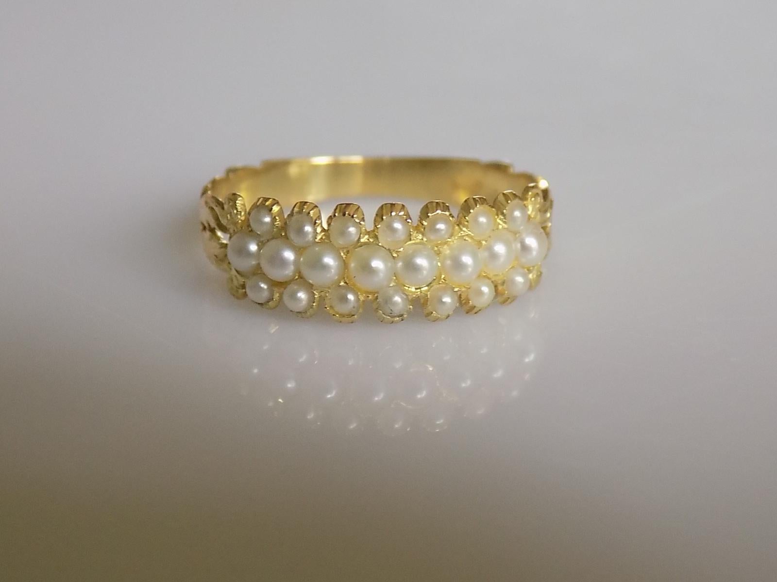 A Georgian c.1800s 15 Carat Yellow Gold and split Pearl half eternity ring. English origin.
Size M 1/2 UK, 6.75 US.
Height of the face 6mm.
Weight 2.0gr.
Unmarked, tested 15 Carat Gold.
Overall very good condition, fully complete with pearls and