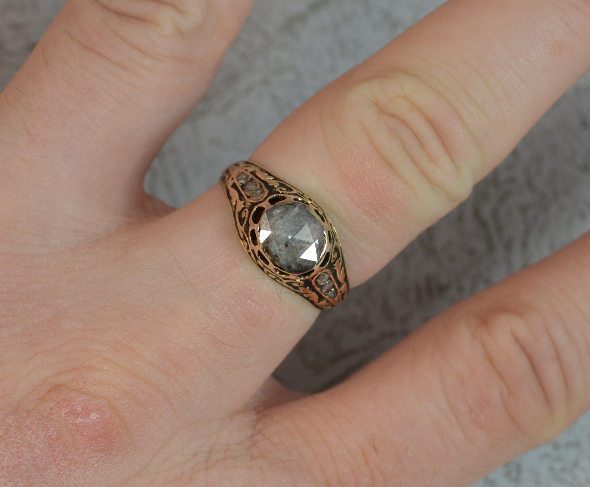 A very fine true Georgian period ring. c1770.
SIZE ; N UK, 6 3/4 US
Designed with a large rose cut diamond of oval shape in closed foiled back bezel setting. 6.6mm x 7.6mm approx. 
A fine 15 carat gold shank three rose cut diamonds to the shoulders