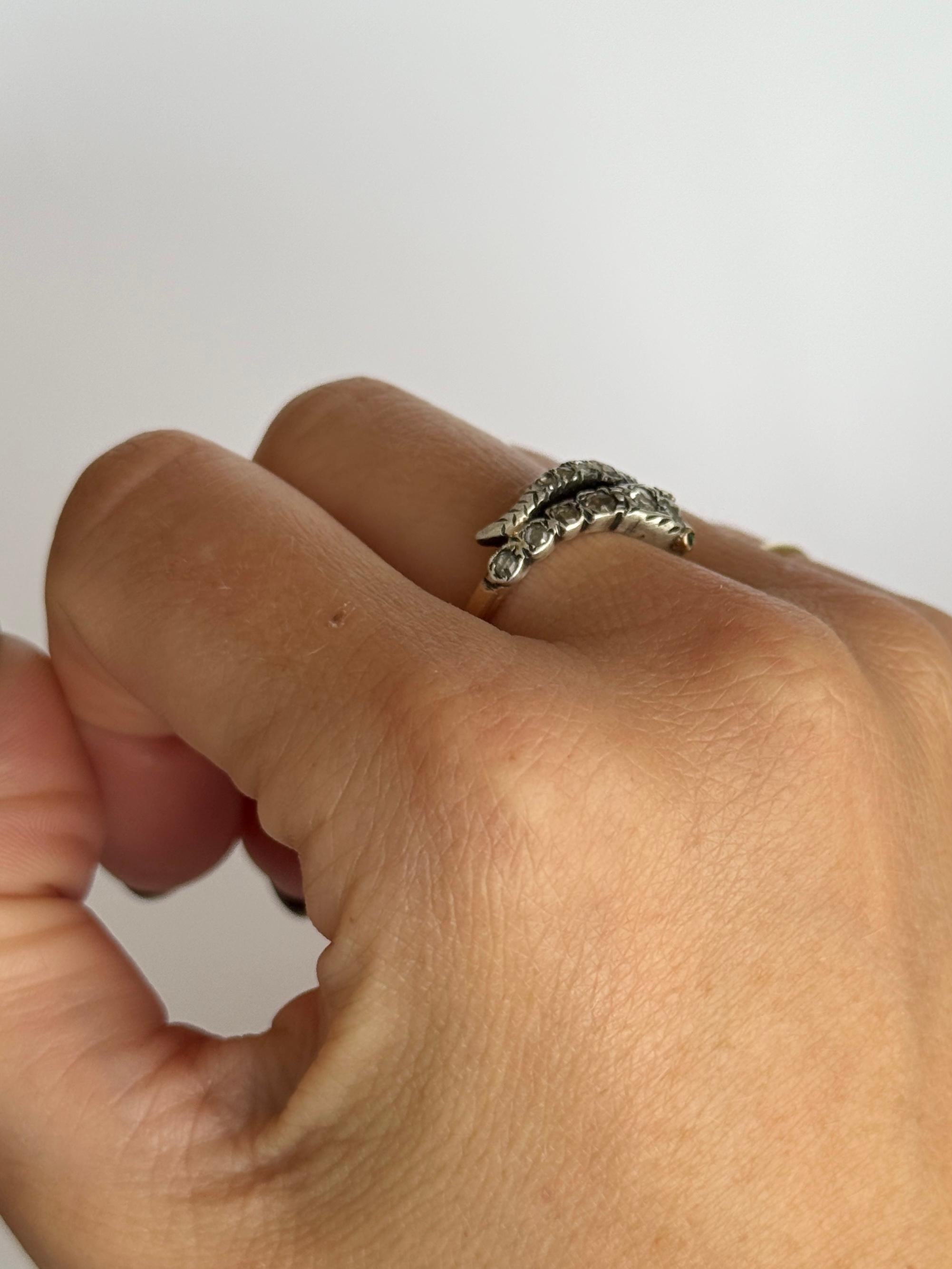 This gorgeous ring is modelled in yellow gold and the stones are set silver. The stones set in the head and tail of this ring are rose cut diamonds and the eyes are emerald points. The approx total of these stones are 65pts. 

Ring Size: O or 7 1/4