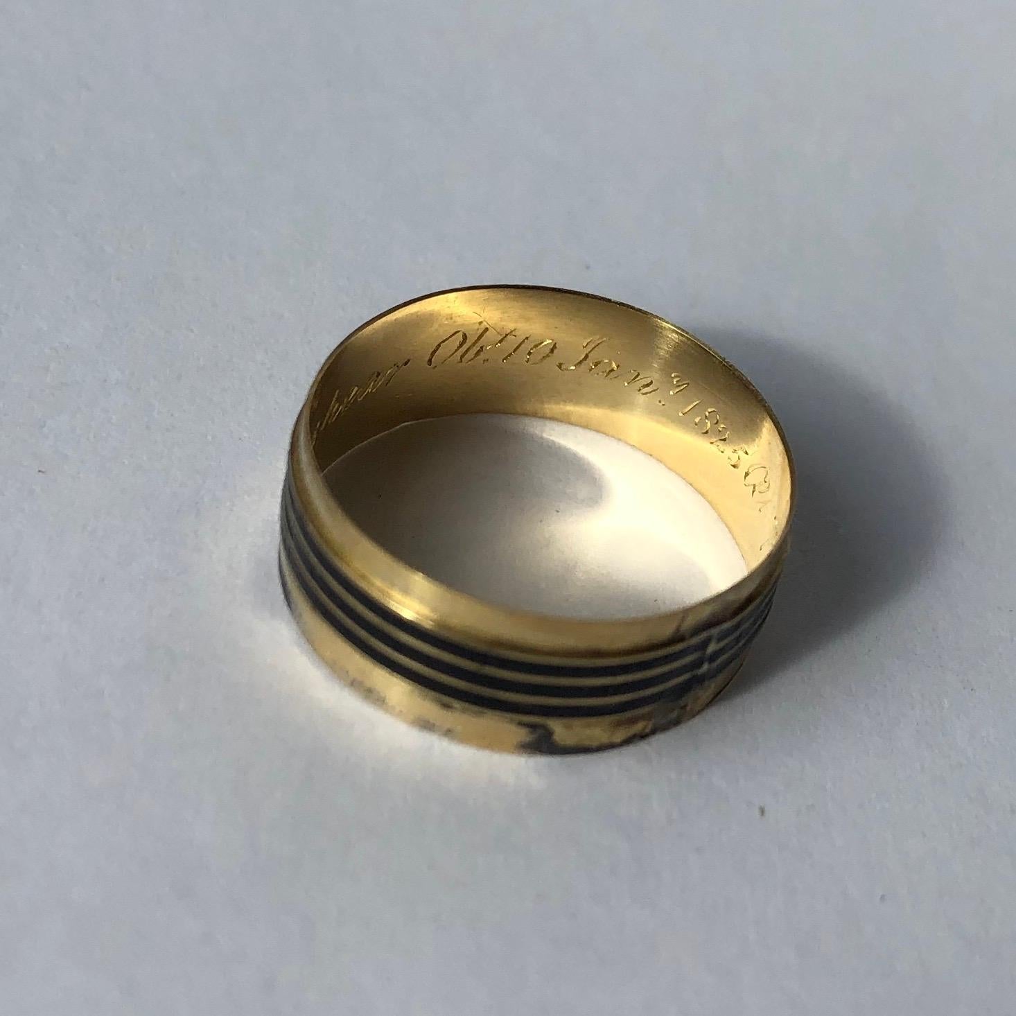 A very fine Georgian mourning ring. This gold band has another band with black enamel banding. On the inside of the band there is an inscription reading 'John Shakespeare Ob10 Jan 1825 at 75'. Made in London, England. 

Ring Size: M 1/2 or 6 1/2