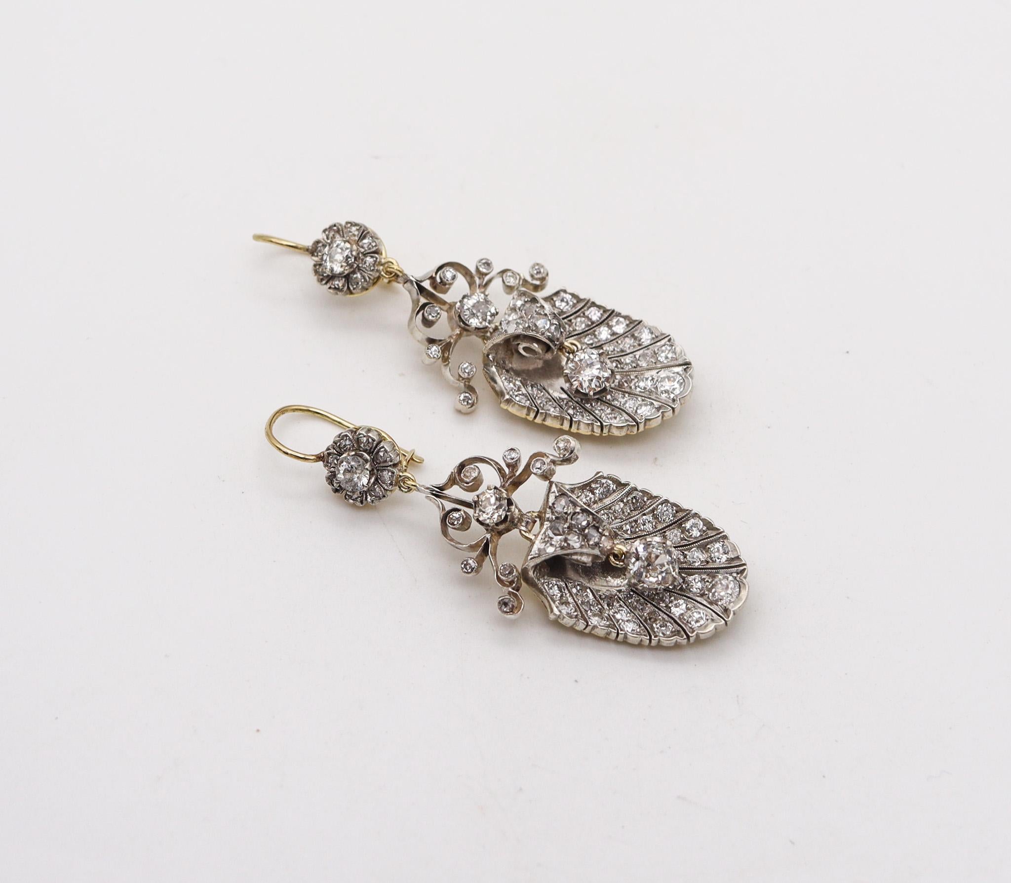Georgian antique dangle drop earrings.

Fabulous antique pair of dangle-drops earrings, created in England during the Georgian period, circa 1800. These diamonds earrings was carefully crafted in solid yellow gold of 15 karats topped with silver for