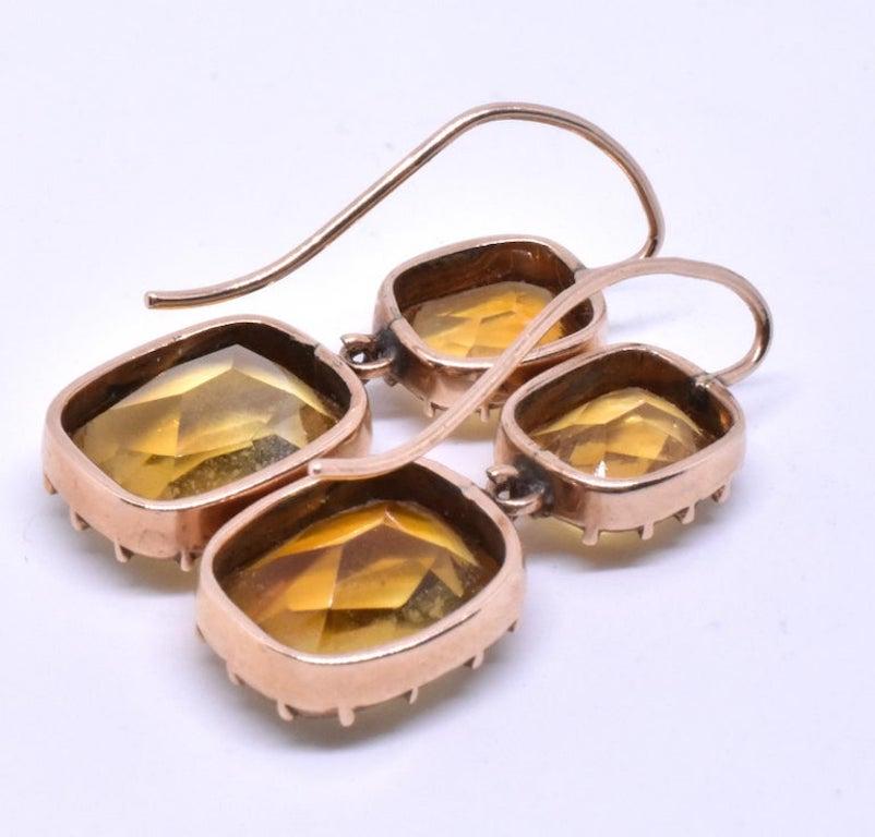 Lovely 18K Georgian pendent drop earrings of citrine, a clear, golden yellow faceted semi precious gemstone. The popularity of pendent earrings in the 1830's was spawned by the fashion for gathered hair styles and the generous décolletage of evening