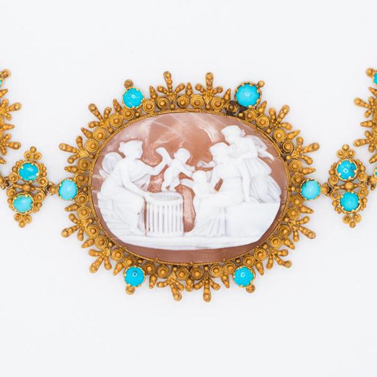 Georgian 18k Yellow Gold Cannetille Carved Shell Cameo and Persian Turquoise Birth of Cupid Rivière c.1800

With wars raging across Europe throughout the early years of the 19th century, austerity was the order of the day. Jewelry was comprised of