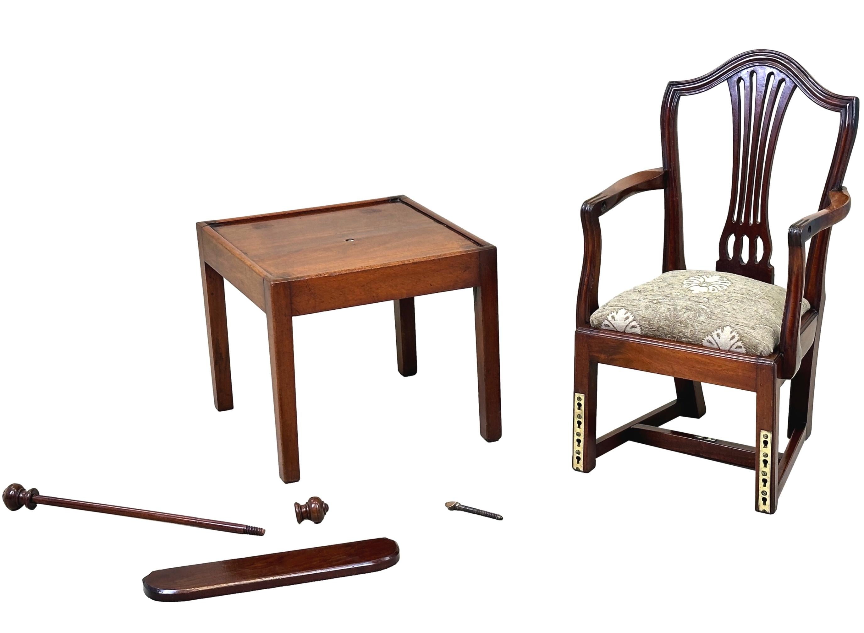A Charming Late 18th Century Georgian, Mahogany, Hepplewhite Period Childs High Chairs, Having Camel Back With Elegant Pierced Splat, Scrolling Arms, Removable Safety Bar And Adjustable Foot Rest Over Detachable Mahogany Table Stand Raised On Square
