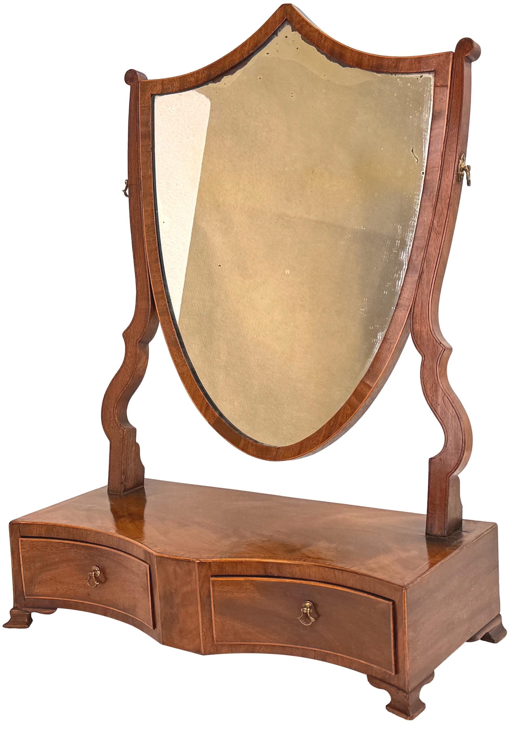 An Extremely Attractive And Very Good Quality 18th Century, George III Period, Mahogany Dressing Table Mirror, With Shield Shaped Swing Plate, Over Well Figured And Rare Double Concave, Two Drawer Base With Crossbanded And Strung Decoration, Raised