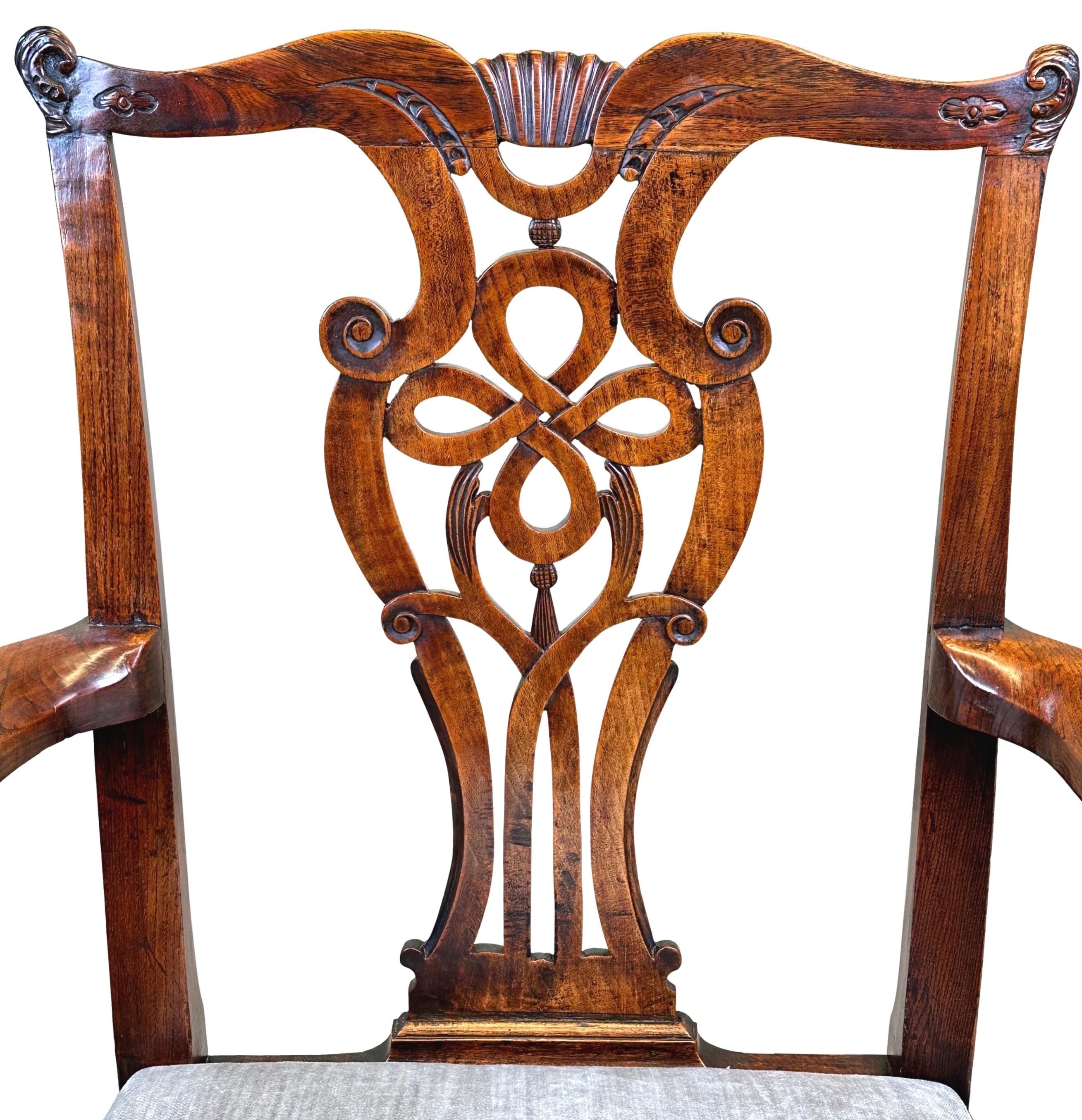 A very attractive George II Period, 18th century Elm carver armchair, Retaining Exceptional Colour & Patina Throughout, Having Elegant Ribbon Carved Pierced Splat Back And Scrolling Arms, Over Drop In Seat Raised On Square Legs And