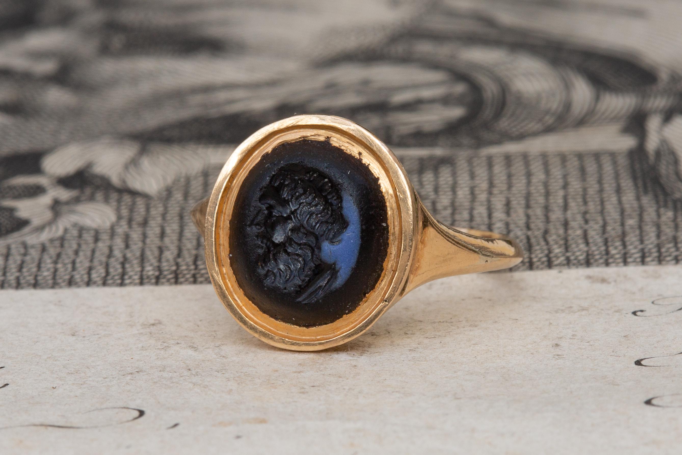 A superb ancient Roman nicolo intaglio set in a late 18th century gold signet ring. Nicolo intaglios are a particular type of intaglio made from sardonyx, agate, chalcedony or glass, whereby a thin lighter layer at the surface is carved away to