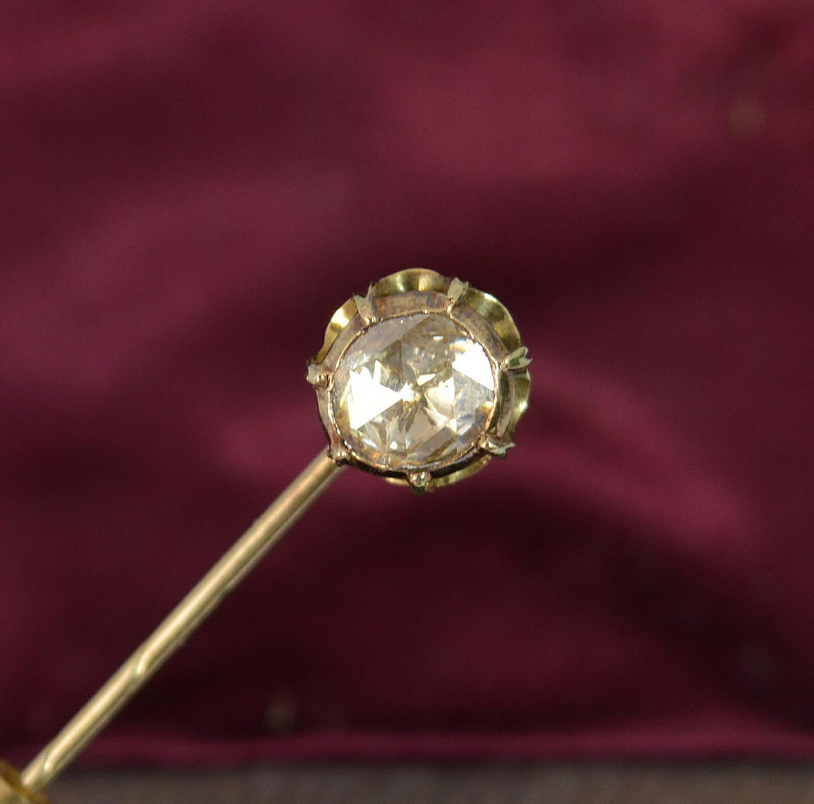 A rare Georgian period stick tie pin.
Modelled in solid gold with a closed foil back setting too.
Designed with a single natural rose cut diamond, 6.3mm diameter stone, spread of approx 1 carat.
Circa 1820.

CONDITION ; Very good for age. Securely
