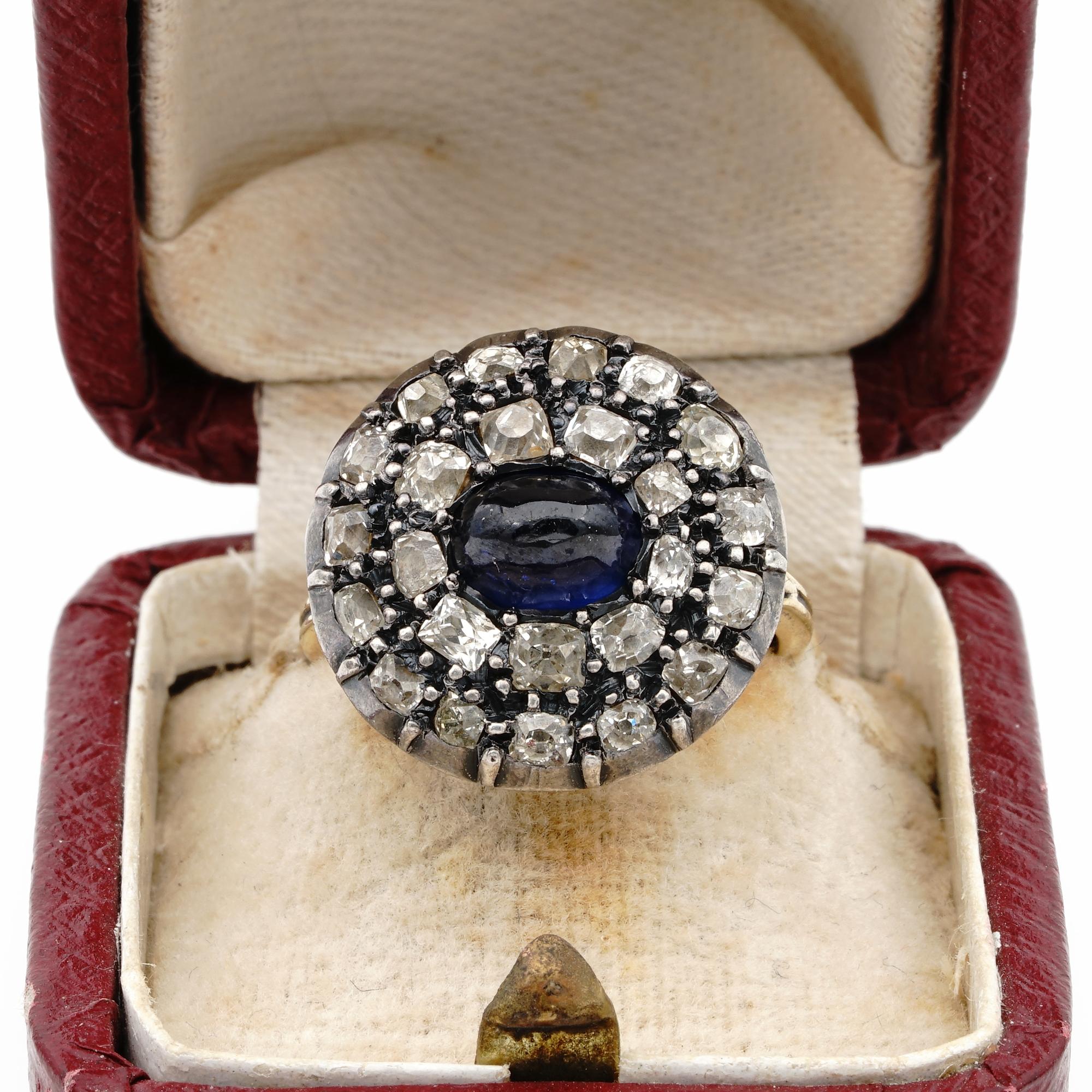 This beautiful Georgian ring is 1790 ca.
Made of 18 Kt gold with silver potions
Round head overwhelmed by antique Flemish cut Diamonds for a total estimate of 2.40 Ct full of sparkle surrounding a centre natural Sapphire of approx cabochon cut of
