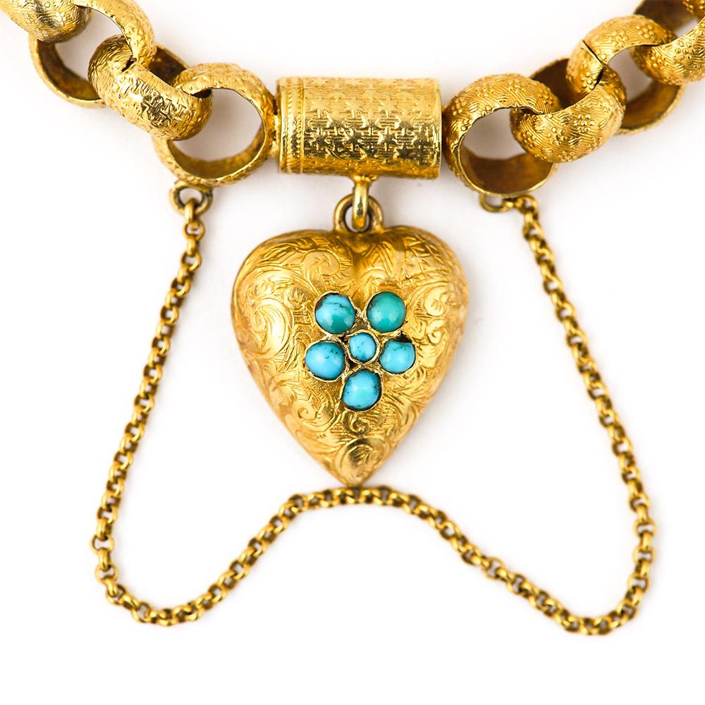 An exceptional Georgian 20 karat gold round belcher link bracelet. Each link is chased with either star or forget me knot motifs. The scroll engraved padlock is set with five turquoise stones, set as a forget me knot, so significant as the plaited