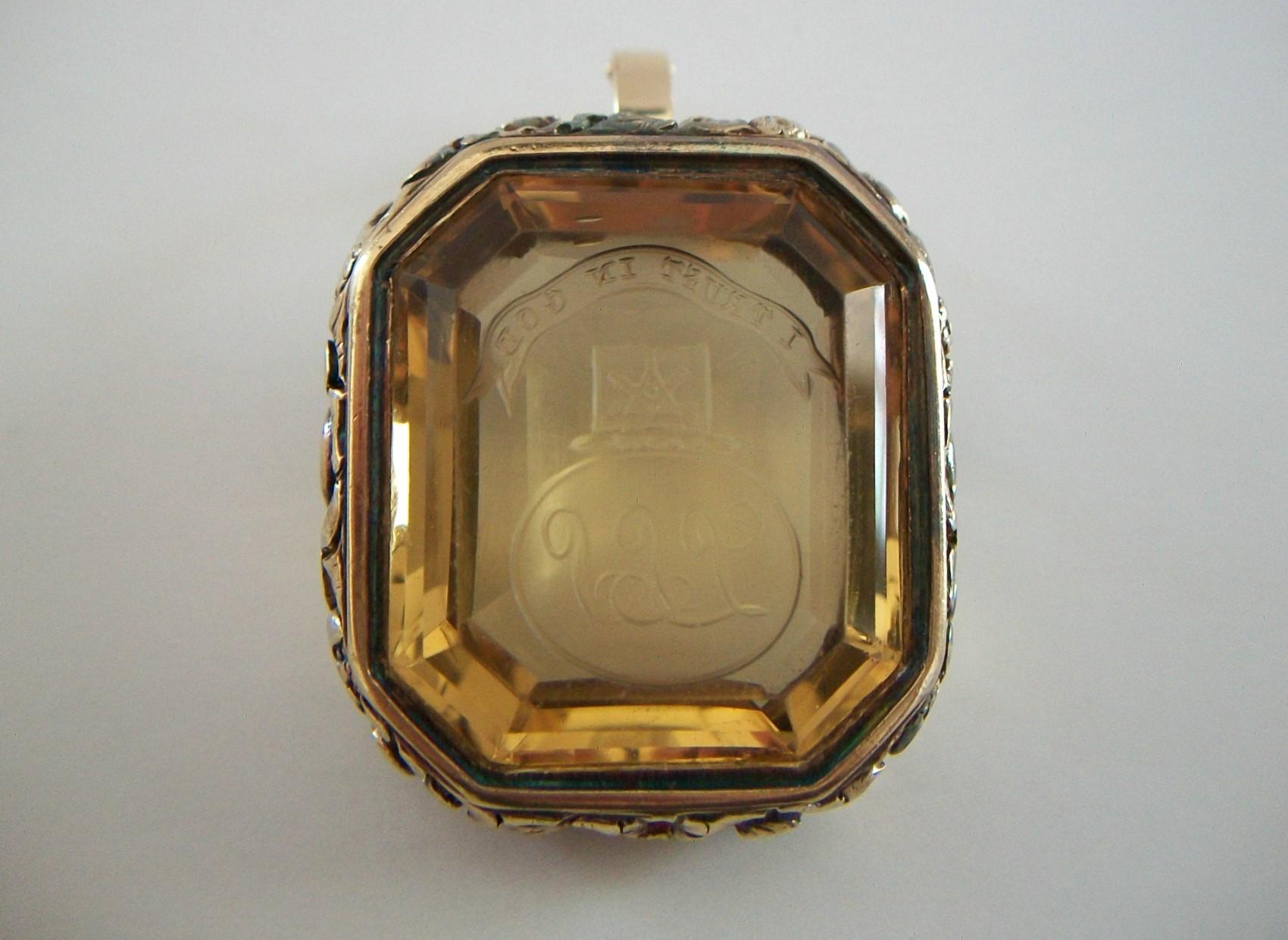 Emerald Cut Georgian 56 Carat Carved Citrine Fob Pendant - Gold Repoussé Frame - Circa 1830 For Sale