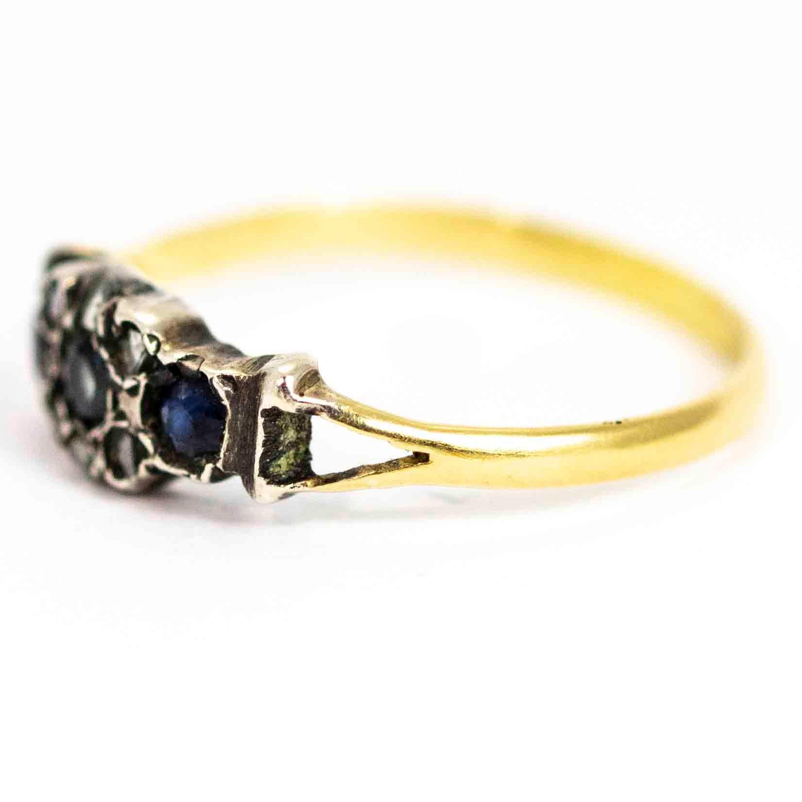 A stunning antique Georgian cluster ring. Set with three beautiful blue topaz and a halo of six rose cut diamonds. The wonderful cluster sits between elegant split shoulders. Modelled in 9 carat yellow gold.

Ring Size: UK L 1/2, US 6