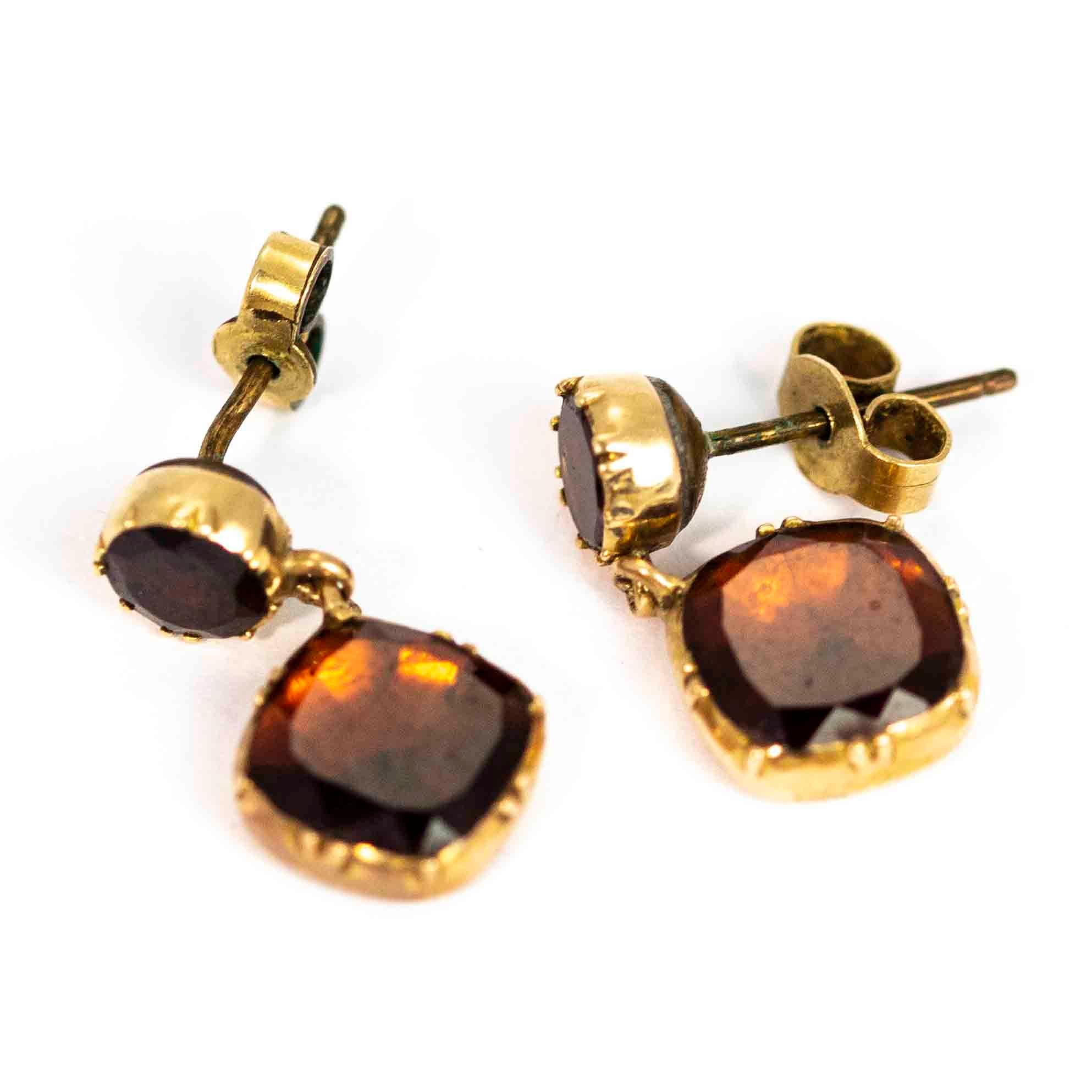 An exquisite pair of antique Georgian drop earrings with stunning bezel set flat cut garnets. Modelled in 9 carat yellow gold with stud backs.

Drop Length: 19mm