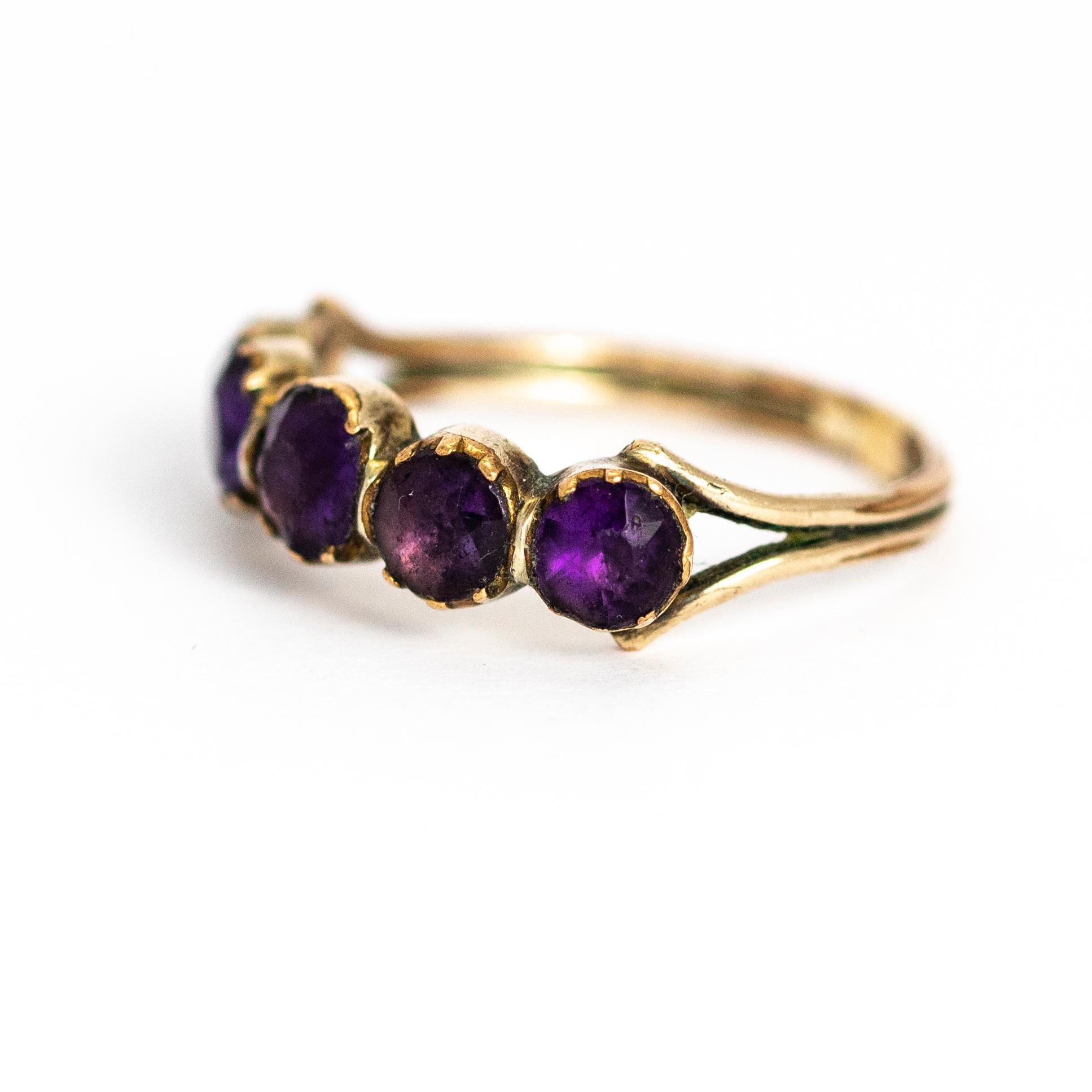 A spectacular antique Georgian five-stone ring set with beautiful deep purple round-cut amethysts. Modelled in 9 karat yellow gold.

Ring Size: UK M 1/2, US 6 1/3