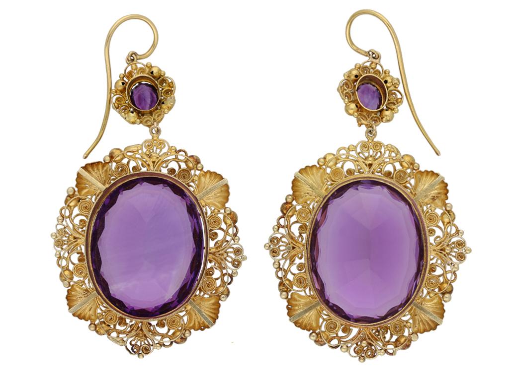 Georgian amethyst and gold cannetille earrings. A matching pair of earrings, each suspending an oval old cut natural unenhanced amethyst in an open back claw setting, two in total with a combined weight of 70.00 carats, set to top with an oval old