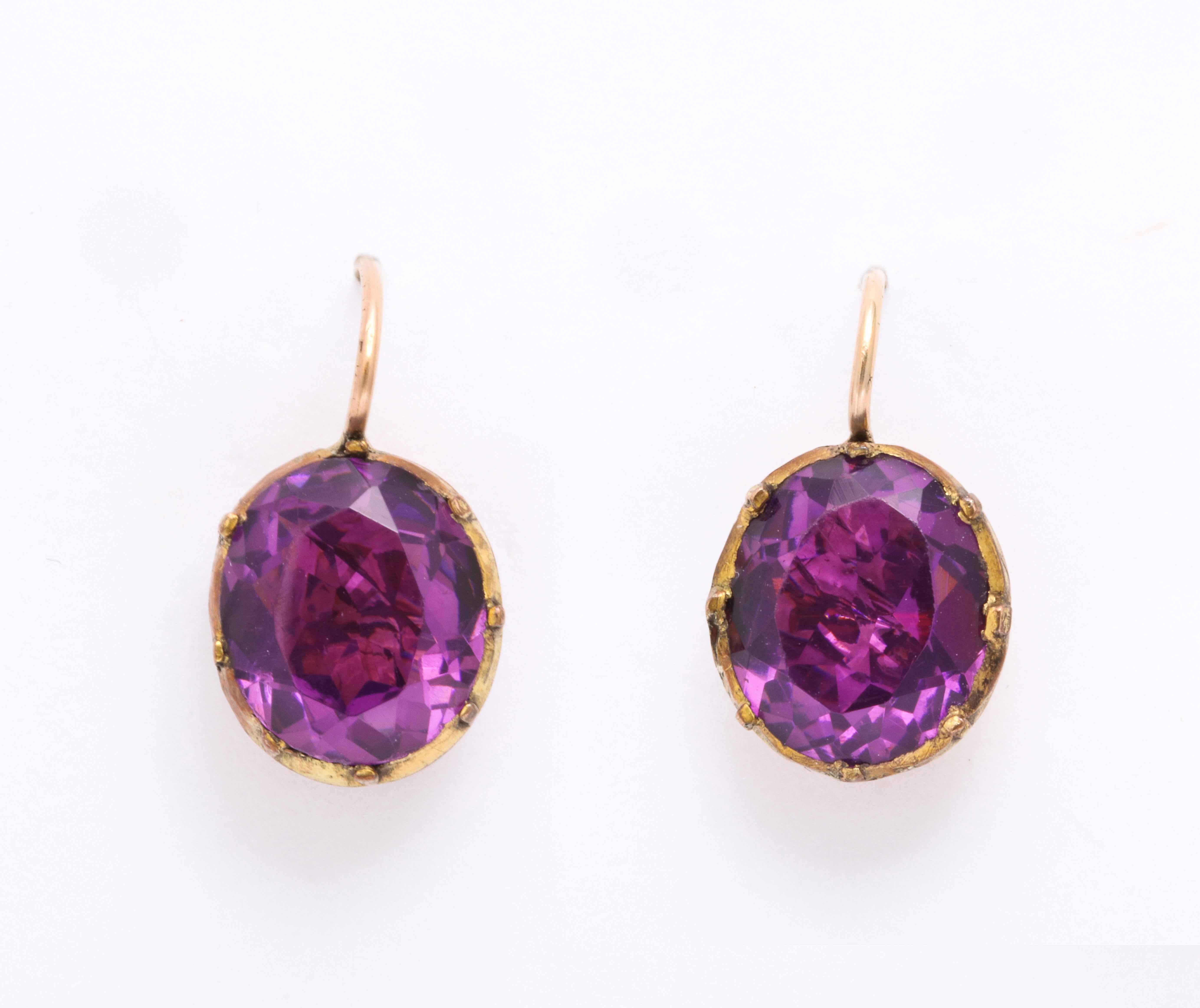The spark of Georgian paste ear drops are a must for collectors and antique jewelry lovers of all ages. This pair, c.1820 is a rich color amethyst that is rare to see. Purple is the color of royalty and of passion.Put them on and you are set for the