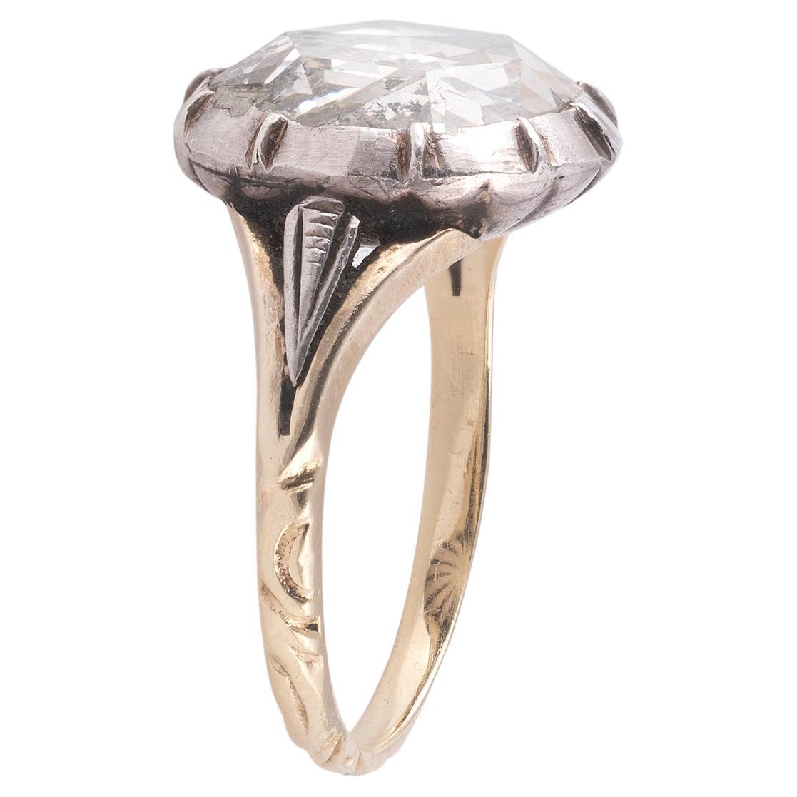 The round-shaped rose-cut diamond in silver and gold closed-back setting and engraved gold shank.
Rose cut (d. 10.5 mm). Weight 3,3g.
Size: 6 1/2