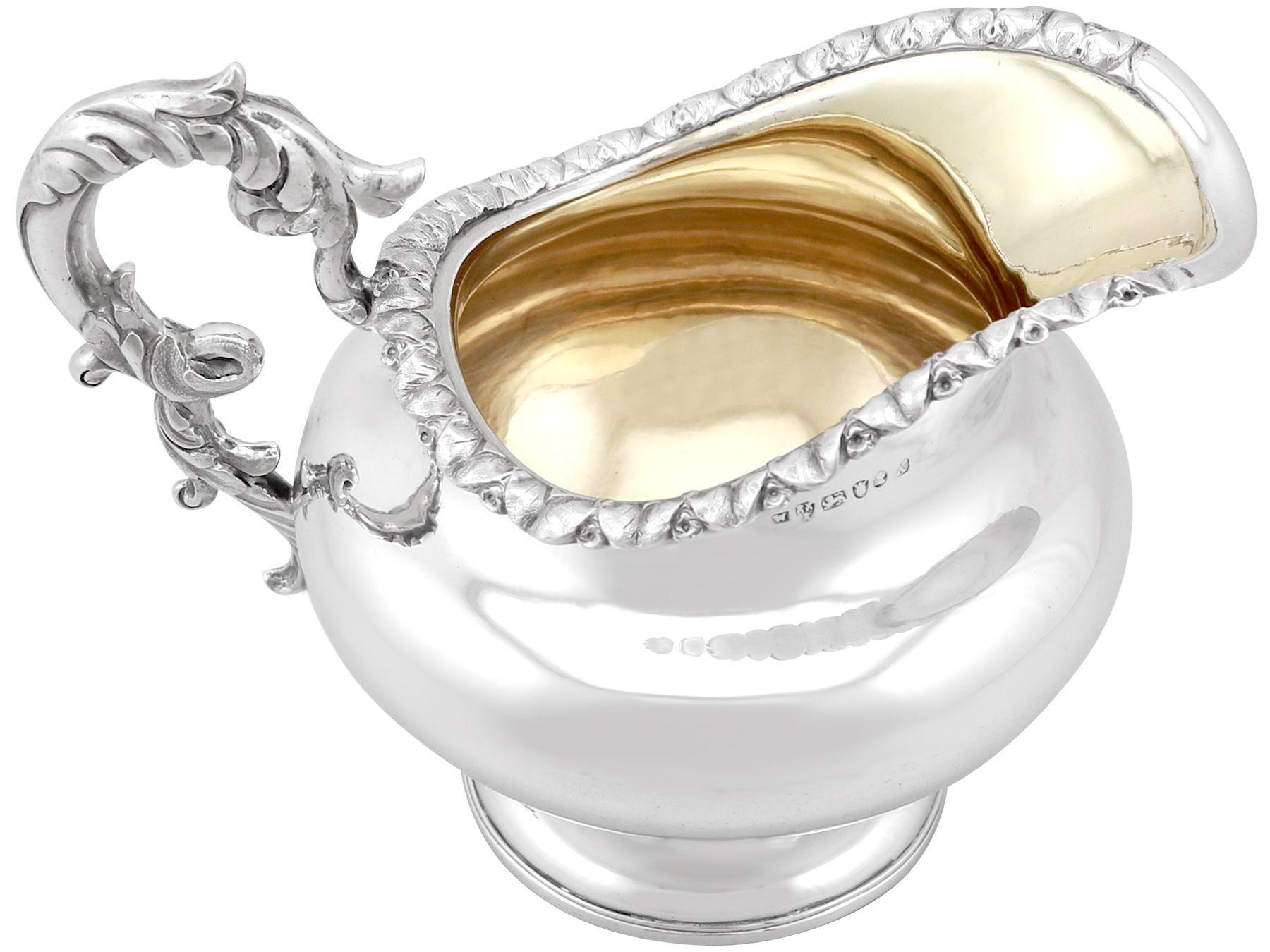 An exceptional, fine and impressive, antique Georgian Newcastle sterling silver cream jug; an addition to our silver teaware collection.

This exceptional antique Newcastle sterling silver cream jug has a circular rounded compressed form onto a