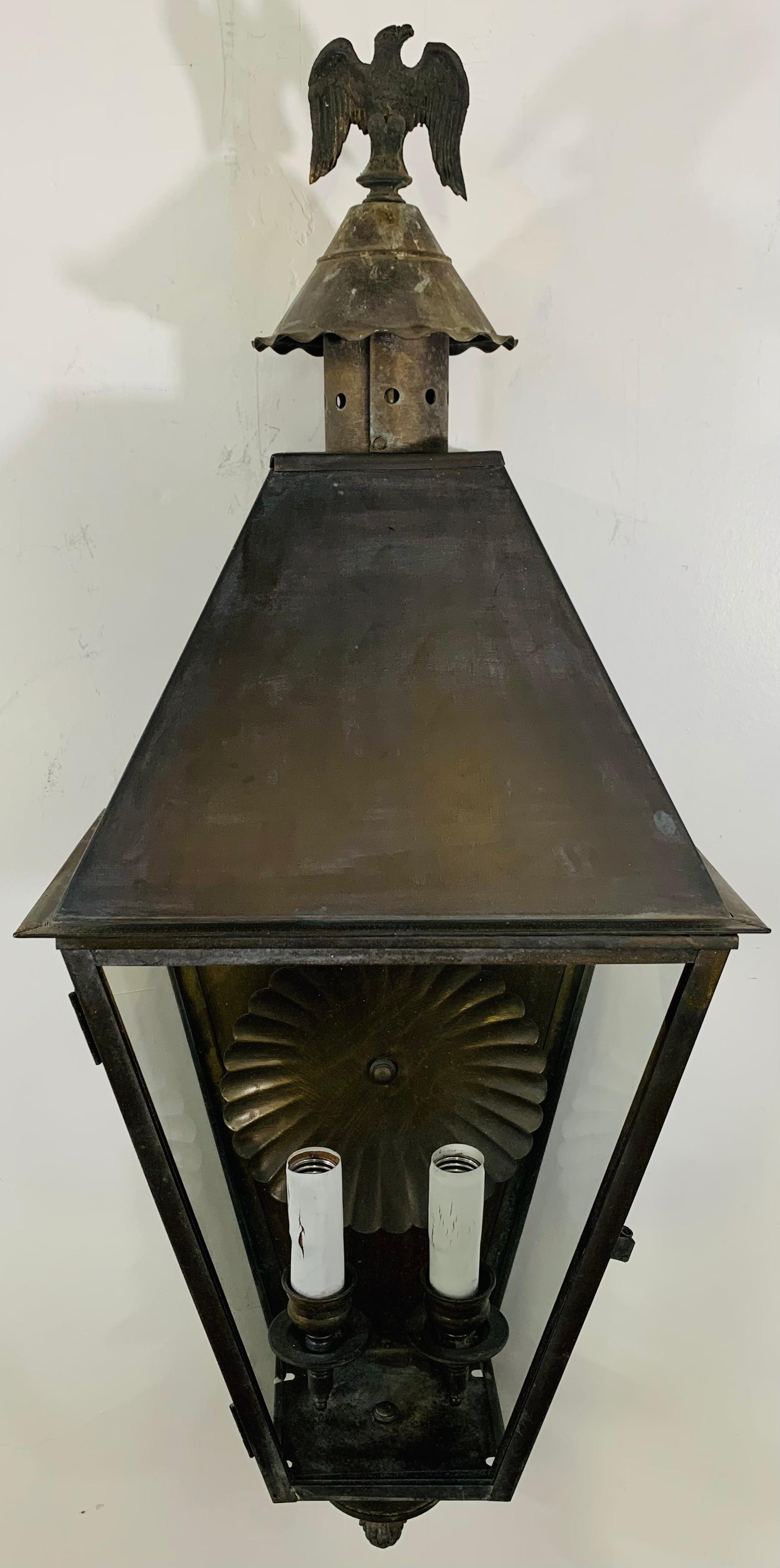 A pair of 1970's Georgian art lighting of lawrenceville, GA and Underwriters Laboratories Inc indoor or outdoor wall lanterns or sconces. Each having two candelabras. The sconces or lanterns features an Eagle design on the top and round handcrafted