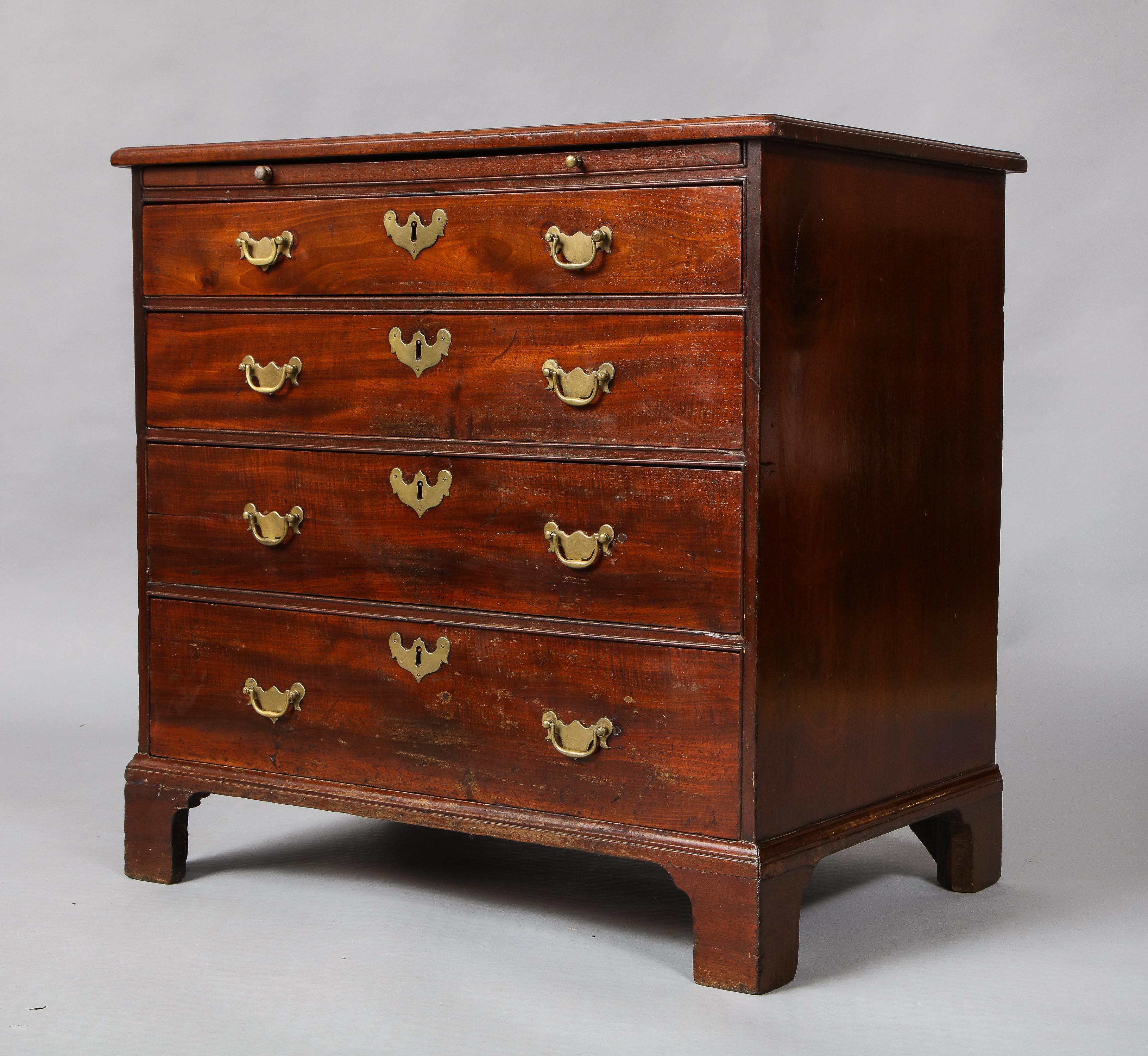 Fine George II mahogany bachelor's or dressing chest, the thumb molded top over brushing slide over four drawers, standing on bracket base, the whole possessing good rich color and made of very dense and nicely figured mahogany.