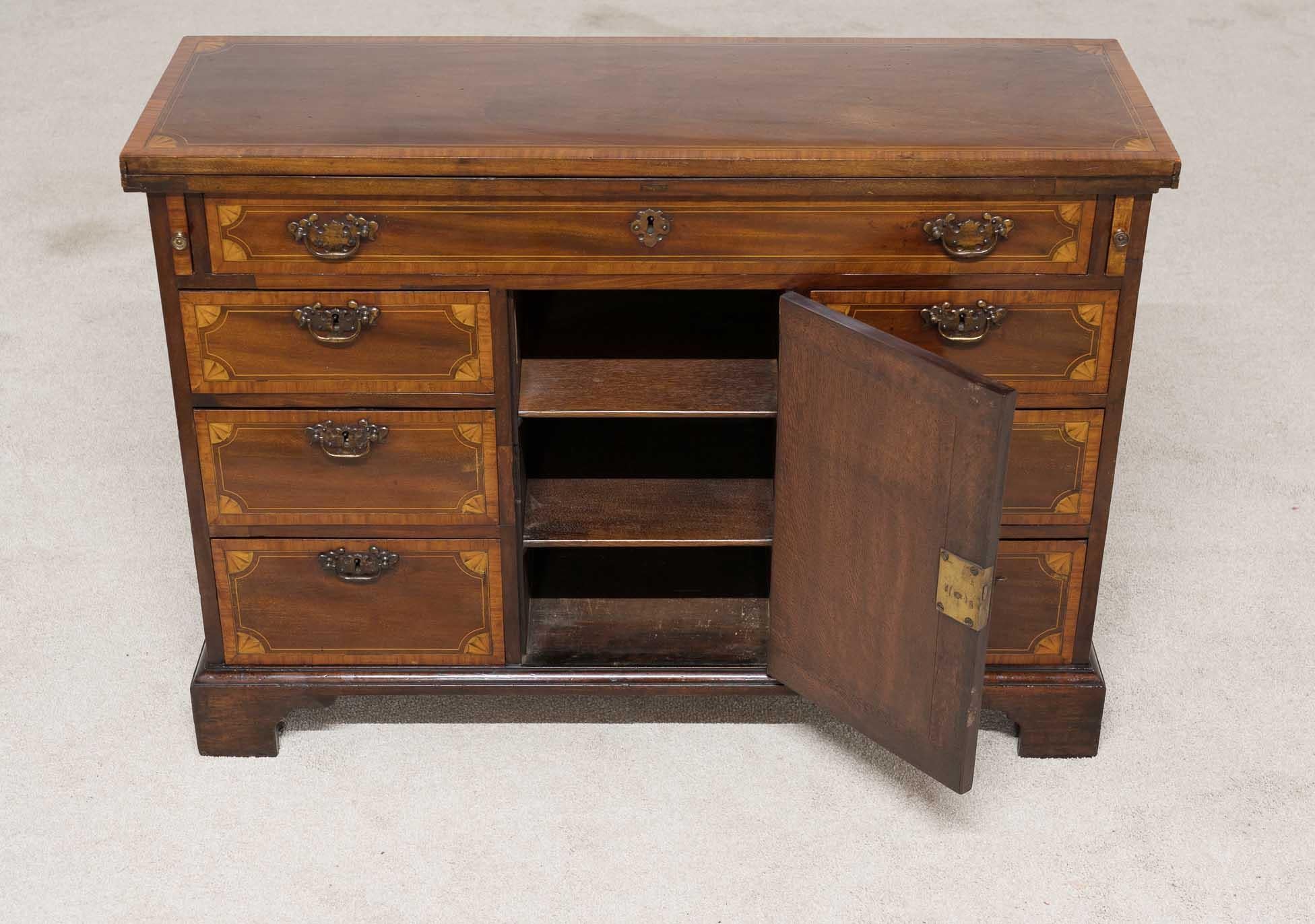 Mahogany and Satinwood Georgian Bachelors Chest Circa 1820
Unusual to find bachelors chests like this which are double fronted
Top opens out via swivel mechanism, designed for laying out clothes for the next day
Inlay work includes cross banding and