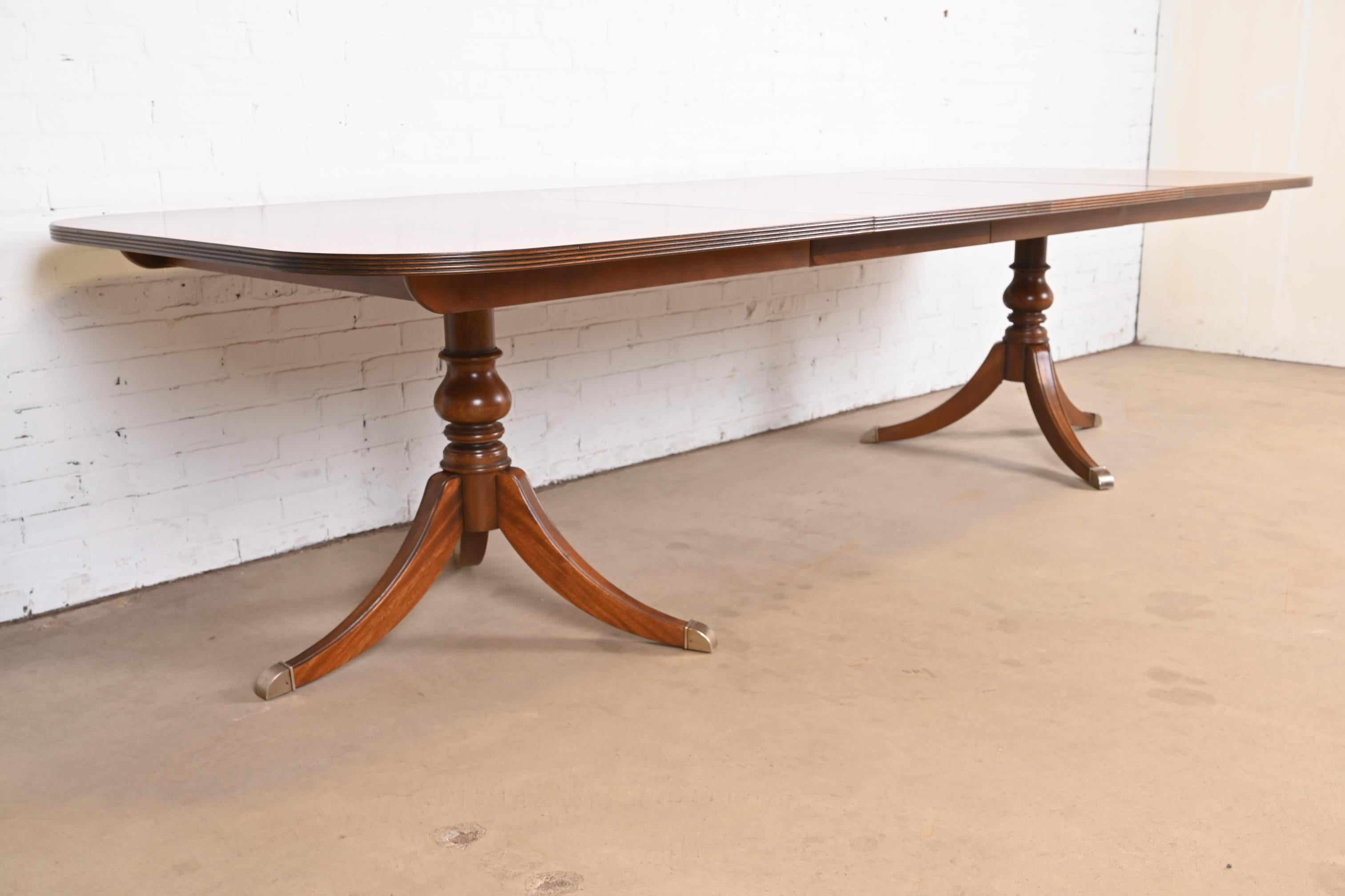 Brass Georgian Banded Flame Mahogany Double Pedestal Extension Dining Table For Sale